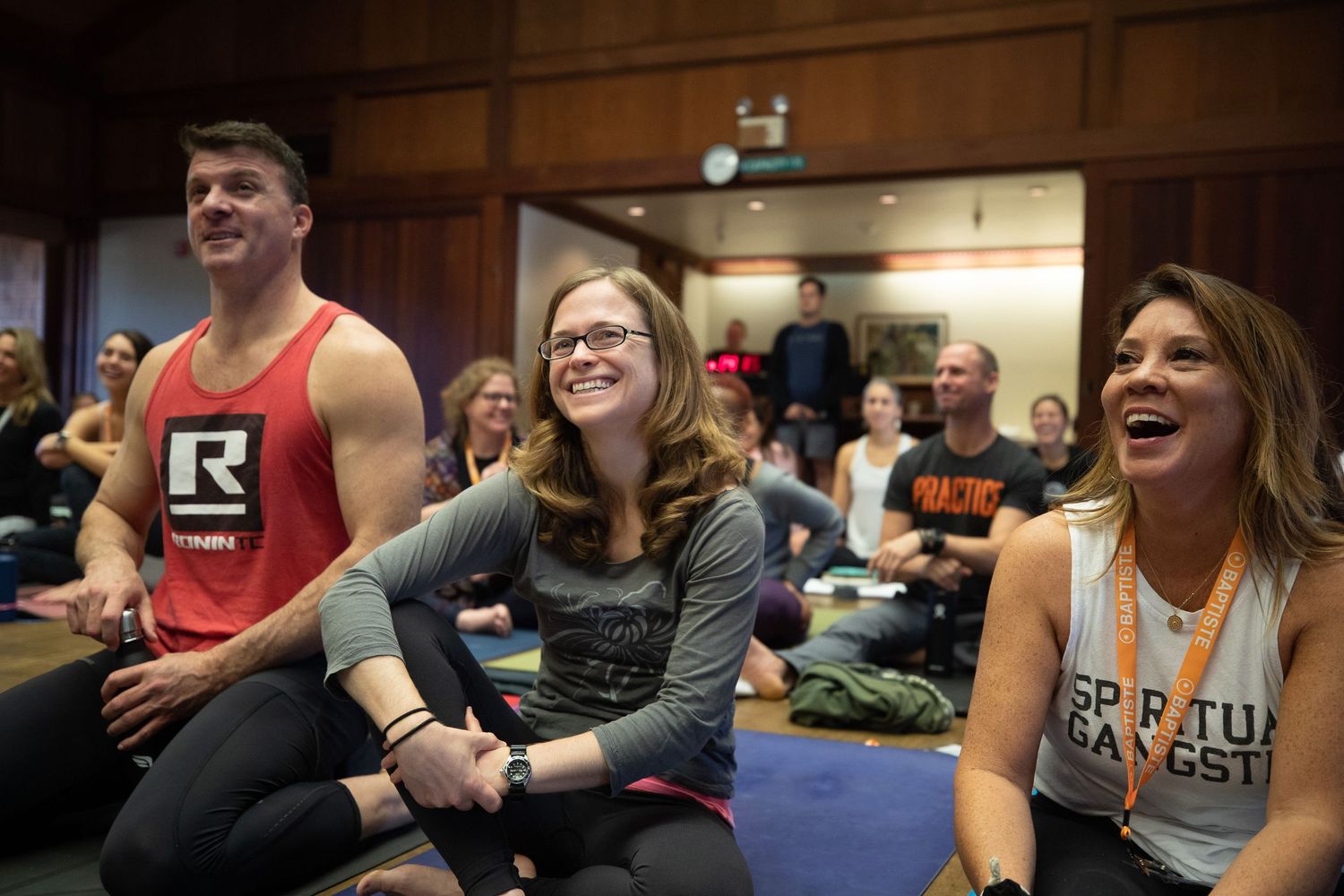 Diverse group of participants enjoying a fitness class experience.