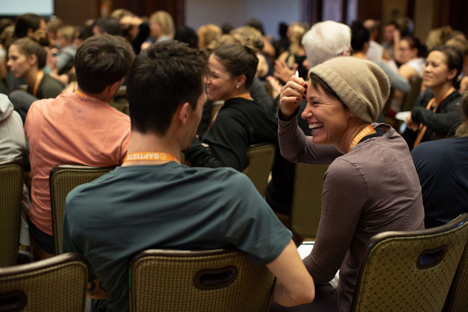 Students engage in animated conversation during a wellness seminar.