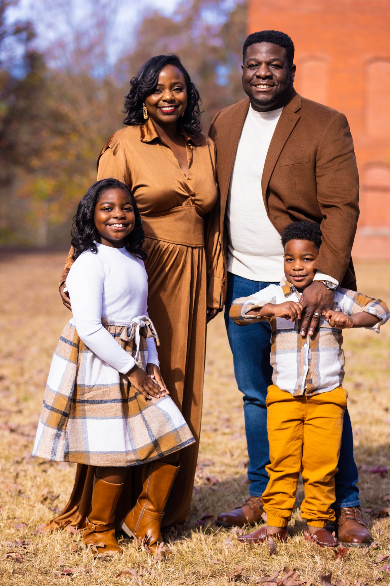Family portrait series in coordinated autumn colors against natural outdoor setting.
