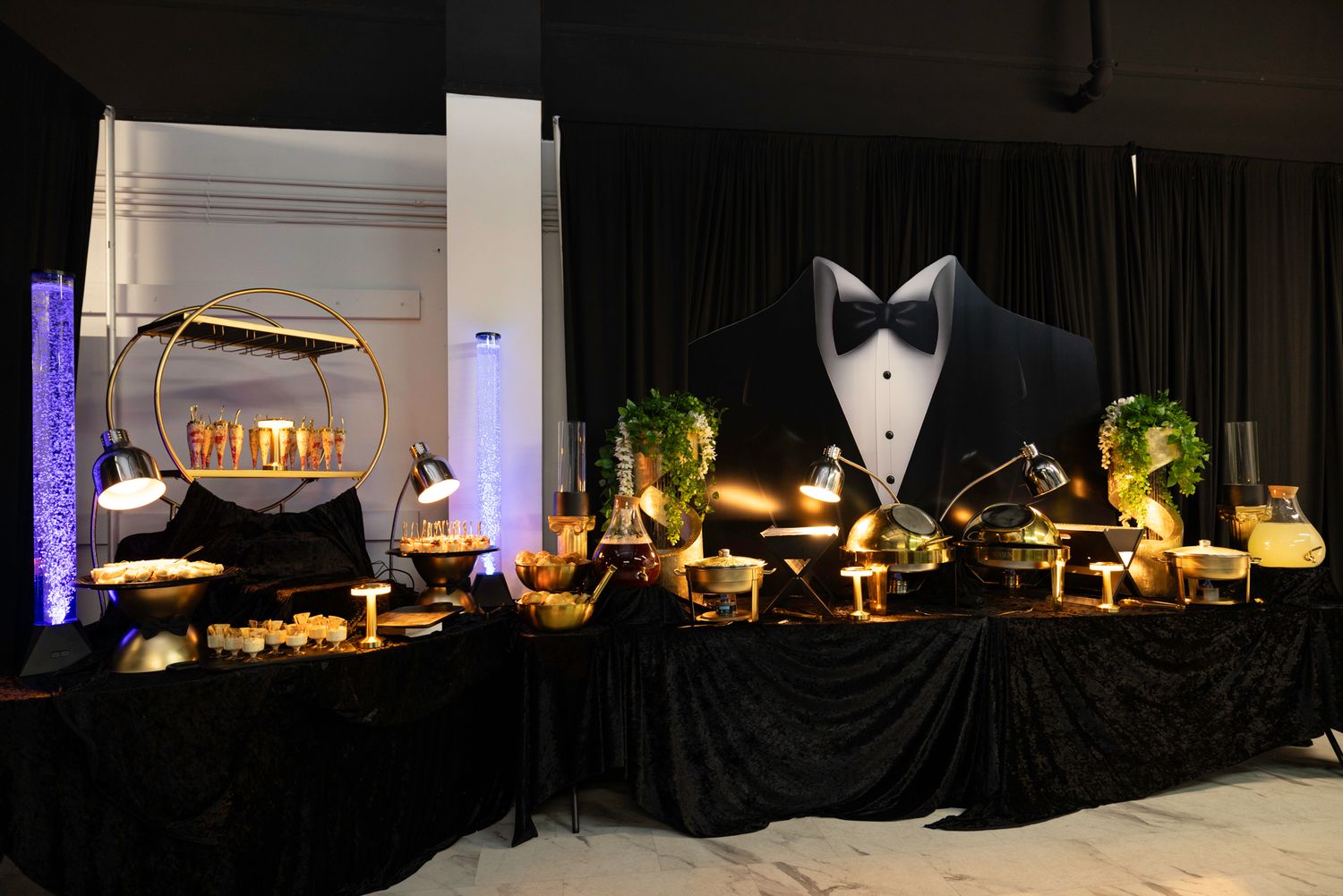 Elegant banquet setup with formal place settings and ambient lighting.