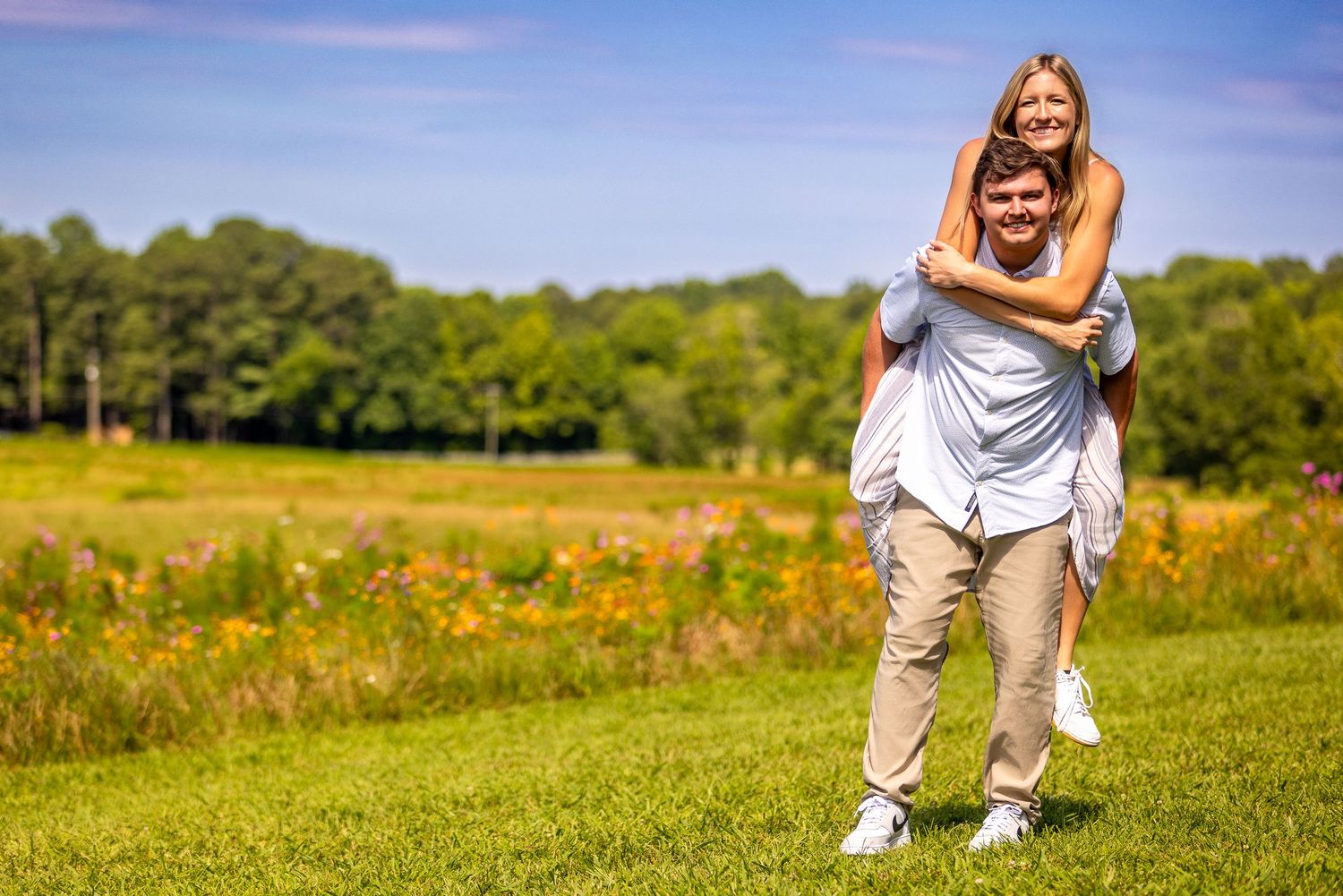 A series of outdoor portraits taken in a grassy field with trees in the background on a sunny day.