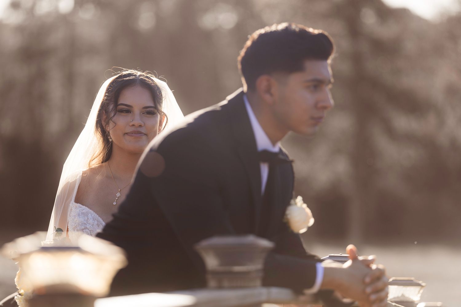 A romantic wedding couple shares an intimate moment during their outdoor photo session.