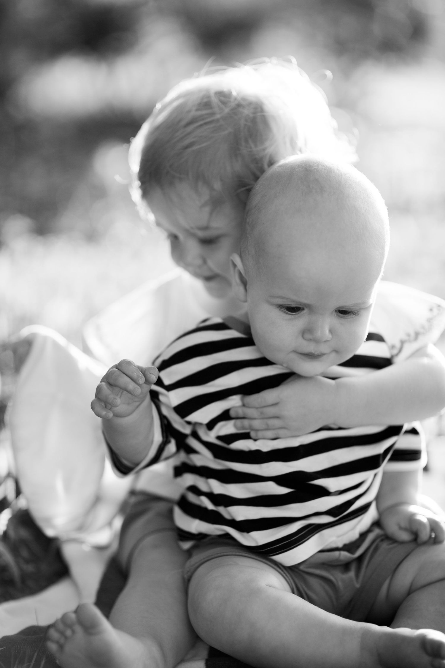 Toddler and baby portrait.