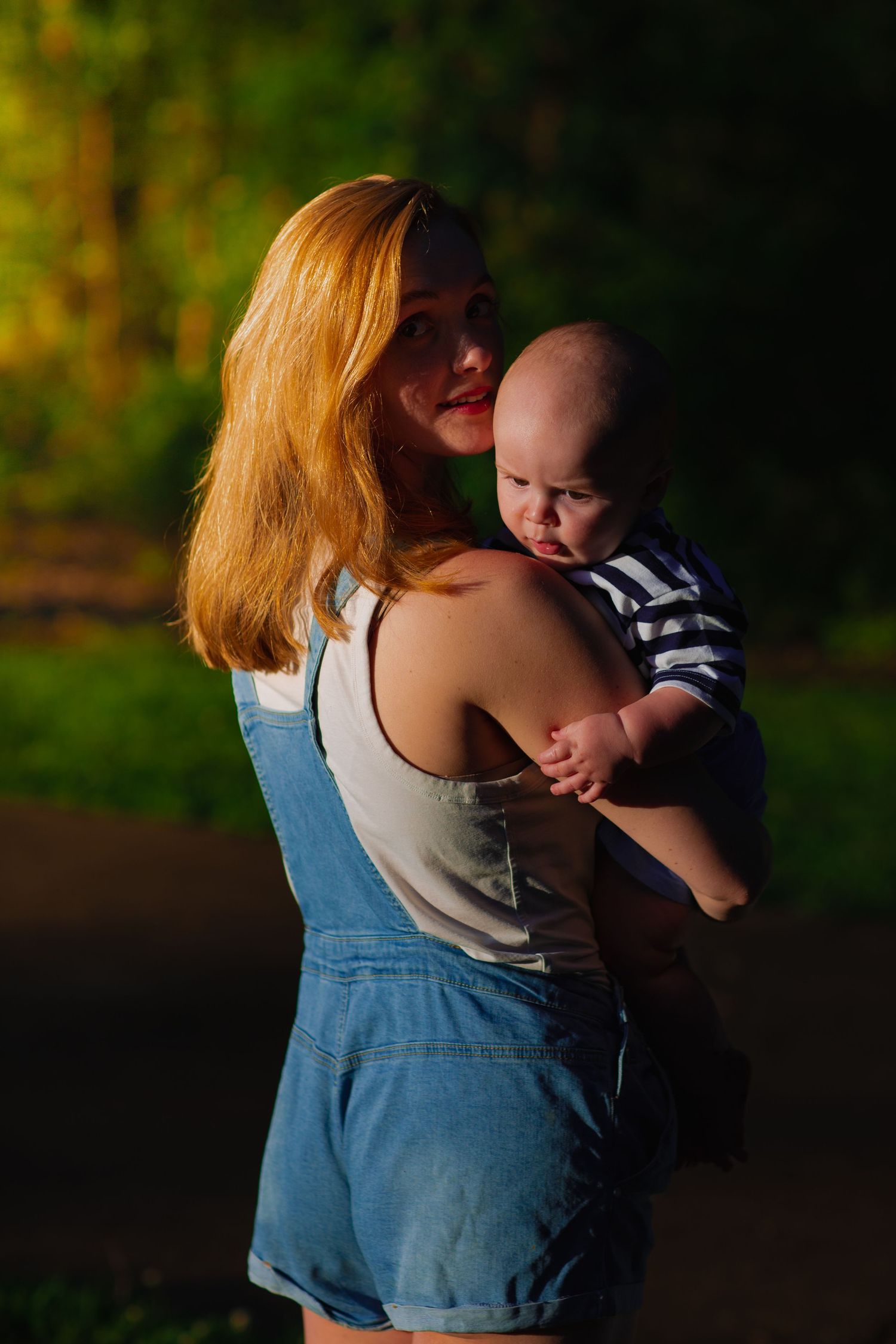 Mother and baby during sunset.