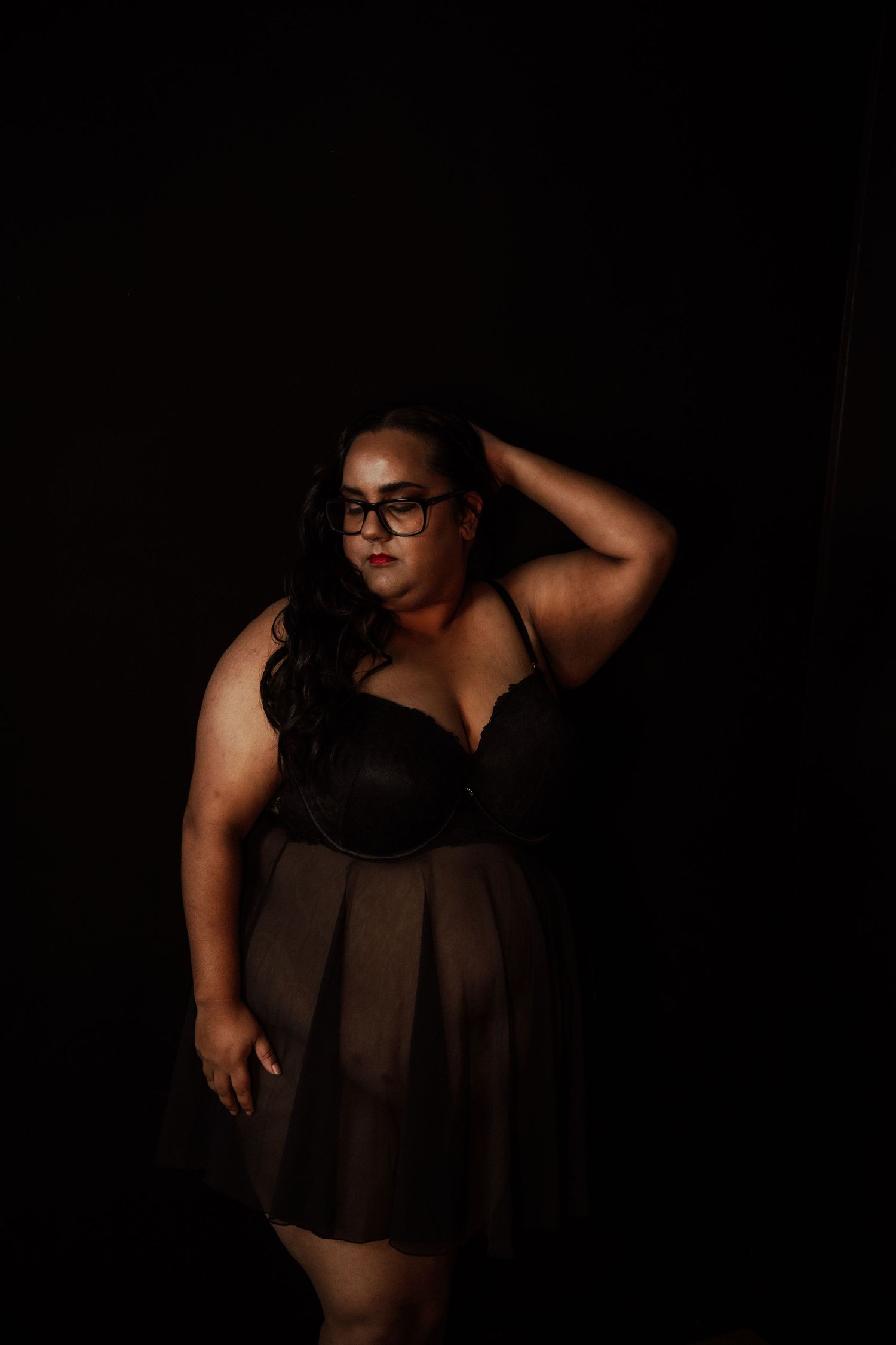 Rain room boudoir photography focused on empowerment, body confidence, and natural beauty, celebrating real bodies with minimal retouching a