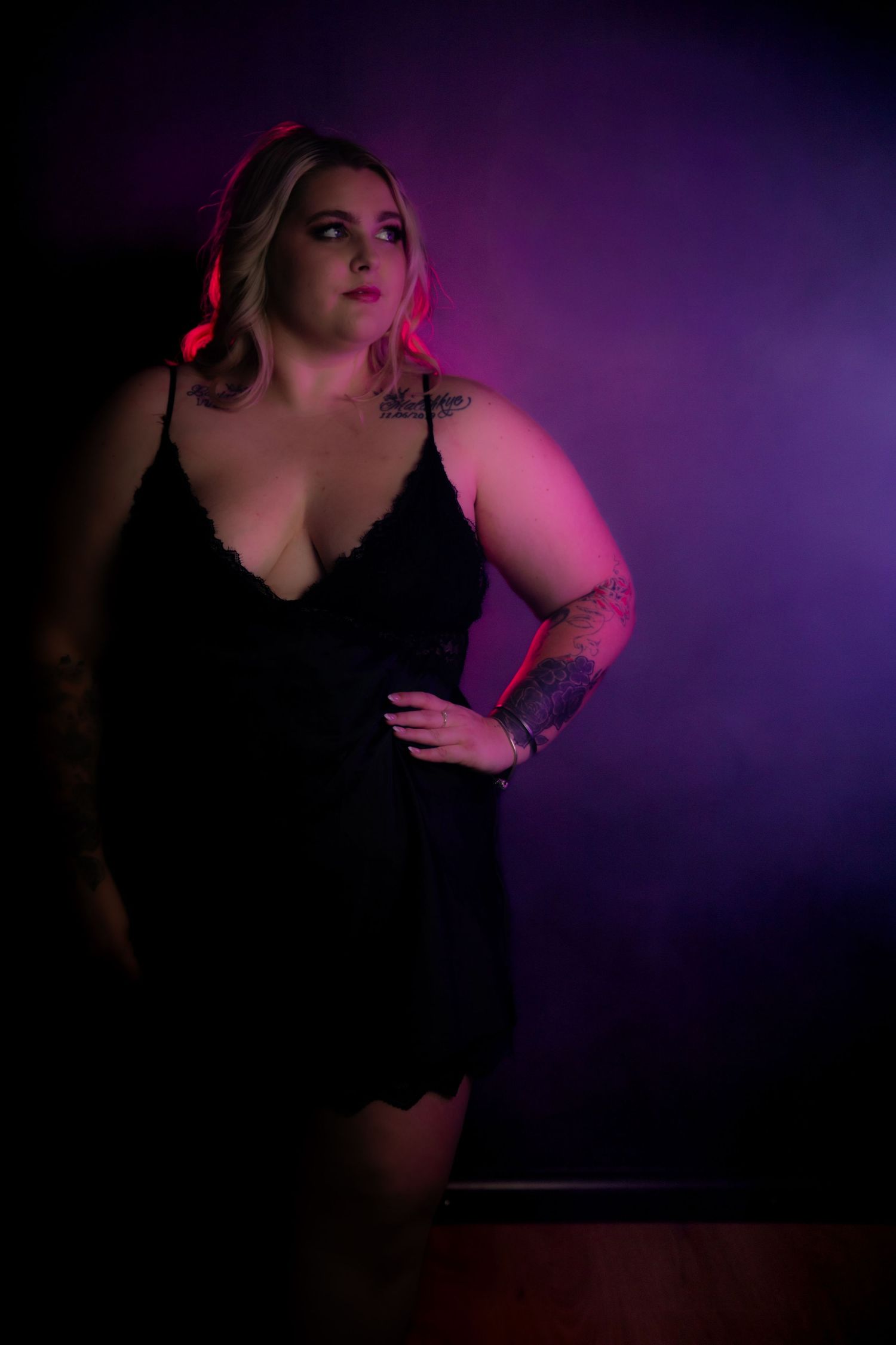 Rain room boudoir photography focused on empowerment, body confidence, and natural beauty, celebrating real bodies with minimal retouching a