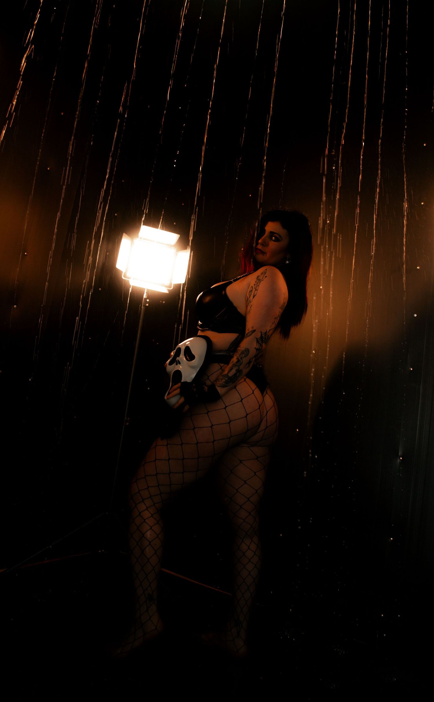 Rain room boudoir photography focused on empowerment, body confidence, and natural beauty, celebrating real bodies with minimal retouching