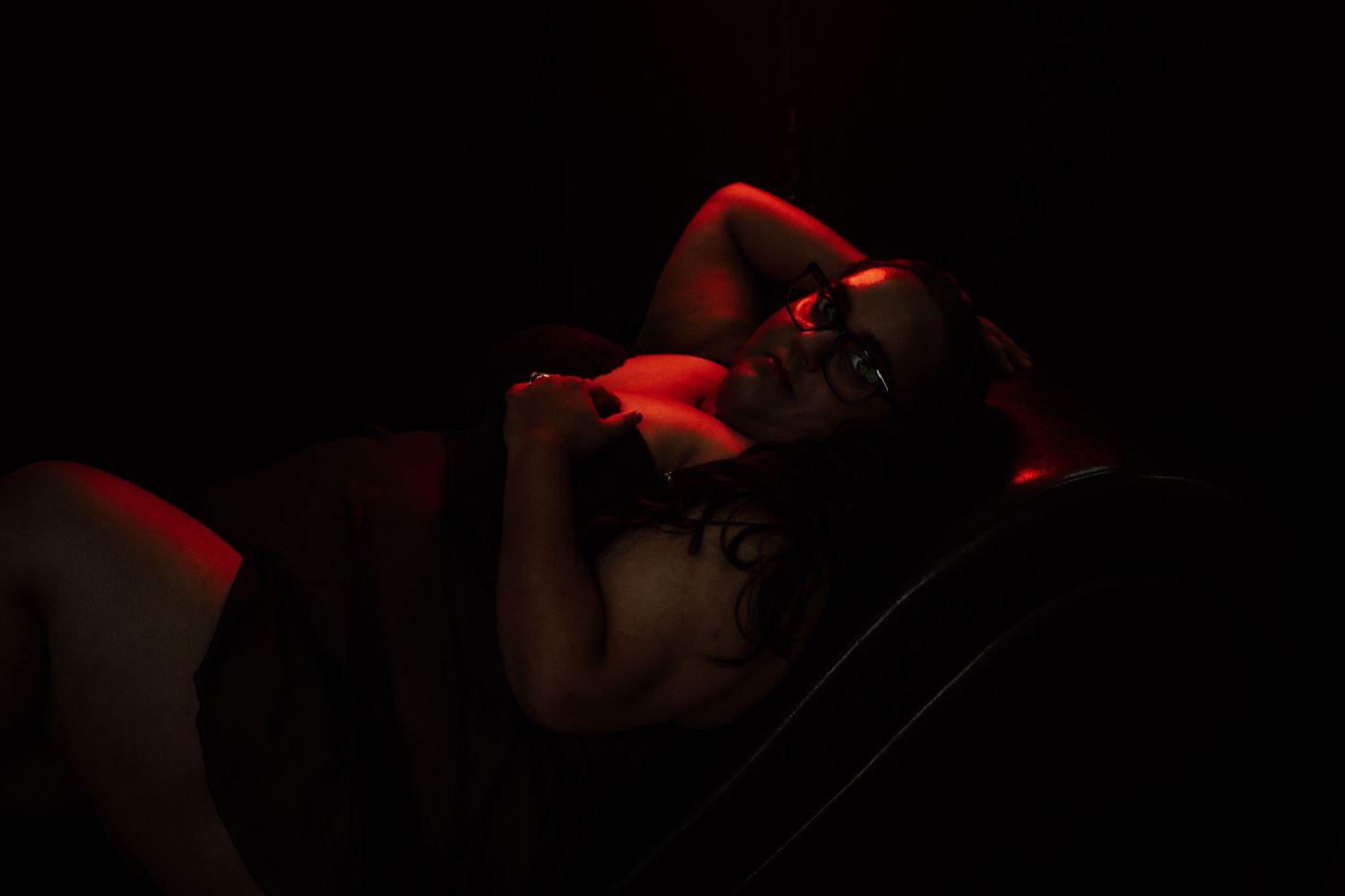 Rain room boudoir photography focused on empowerment, body confidence, and natural beauty, celebrating real bodies with minimal retouching a