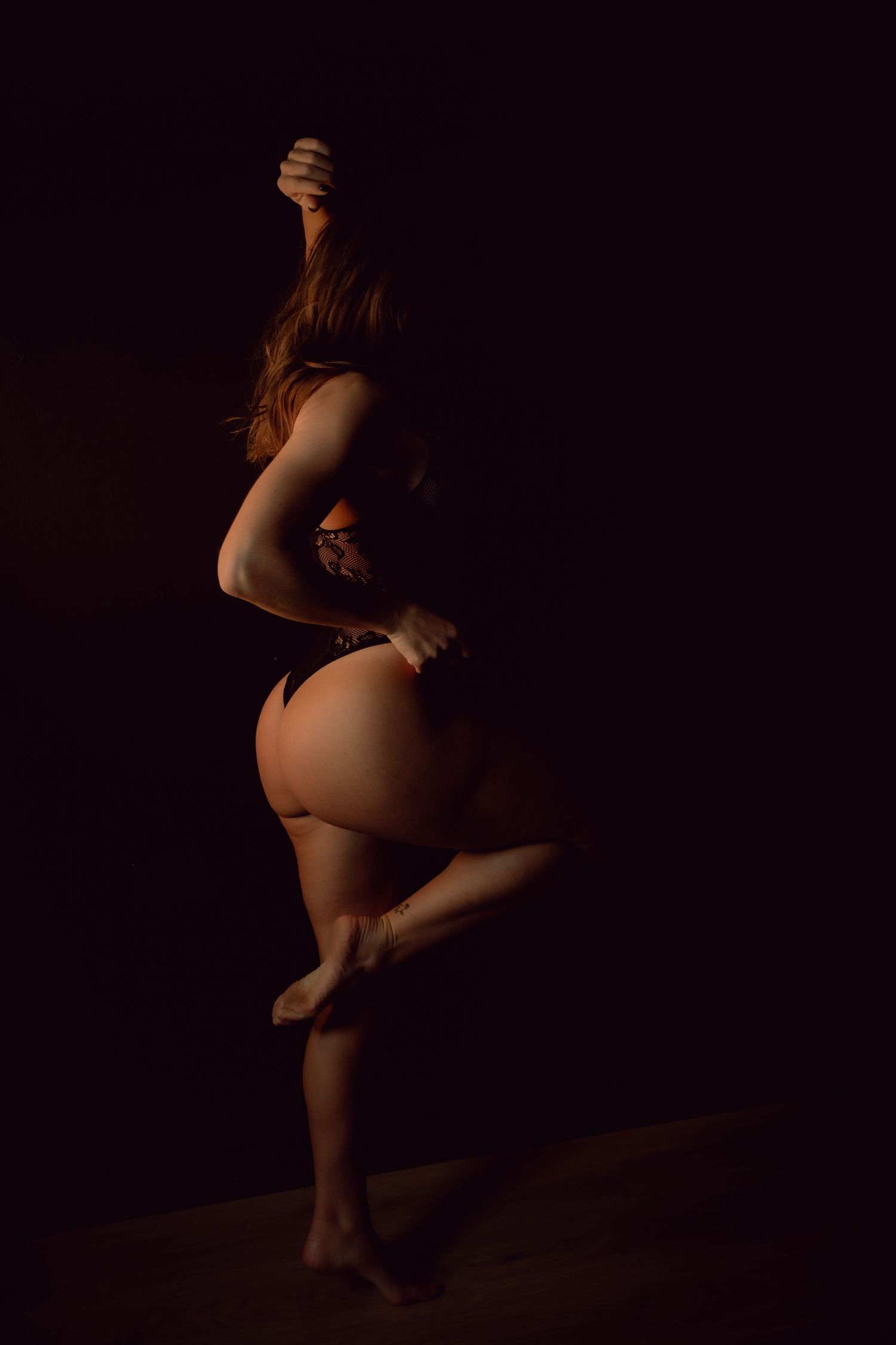 Rain room boudoir photography focused on empowerment, body confidence, and natural beauty, celebrating real bodies with minimal retouching a