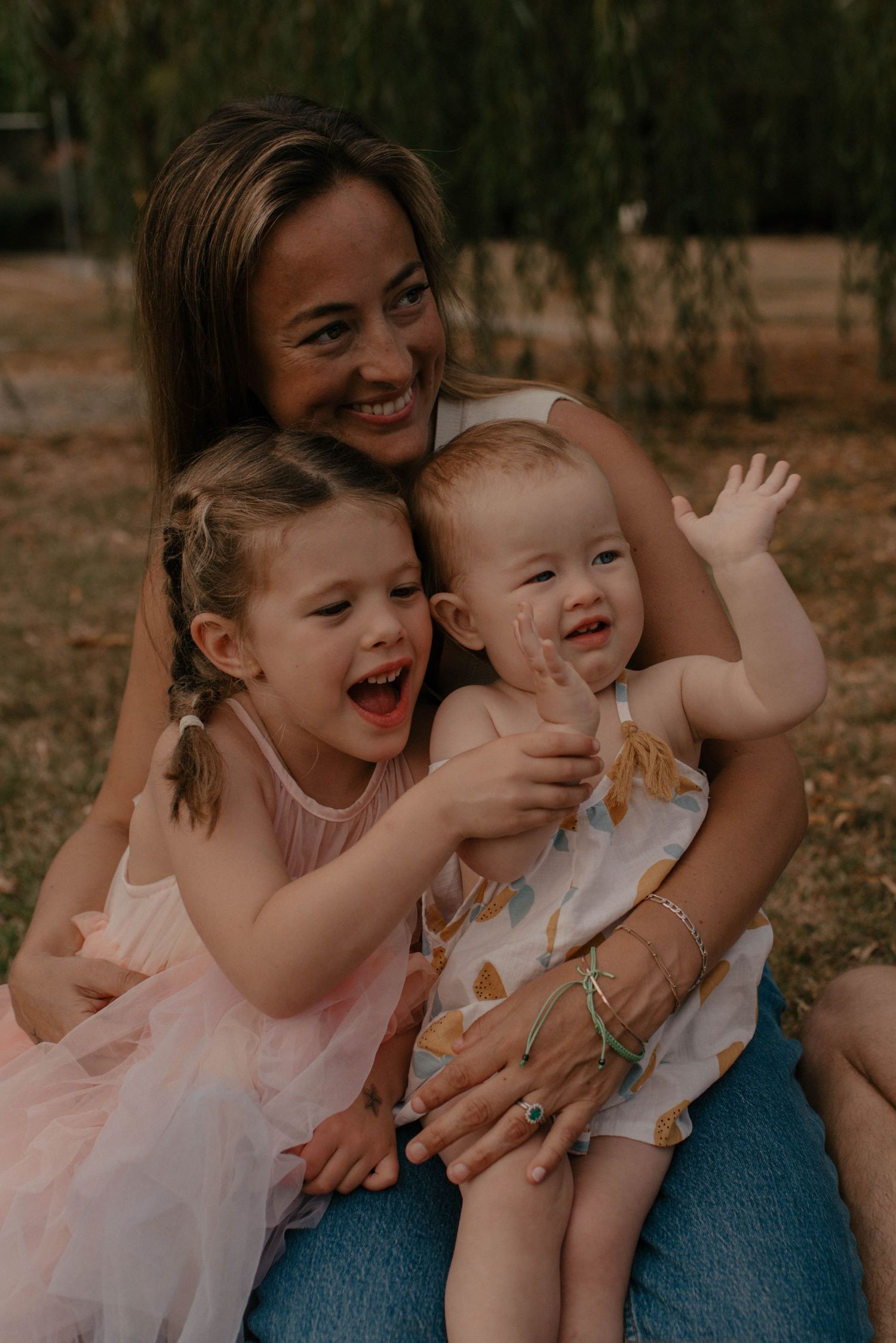 A heartwarming series of candid moments showing joyful laughter and embraces between parent and child outdoors.