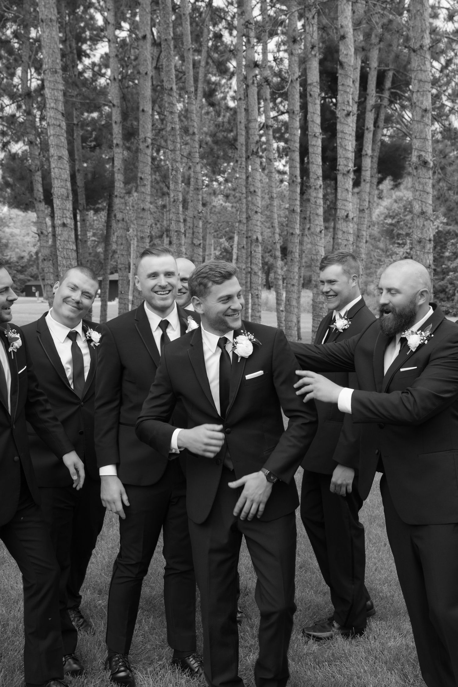 candid groomsmen portrait at la pointe events in somerset wisconsin
