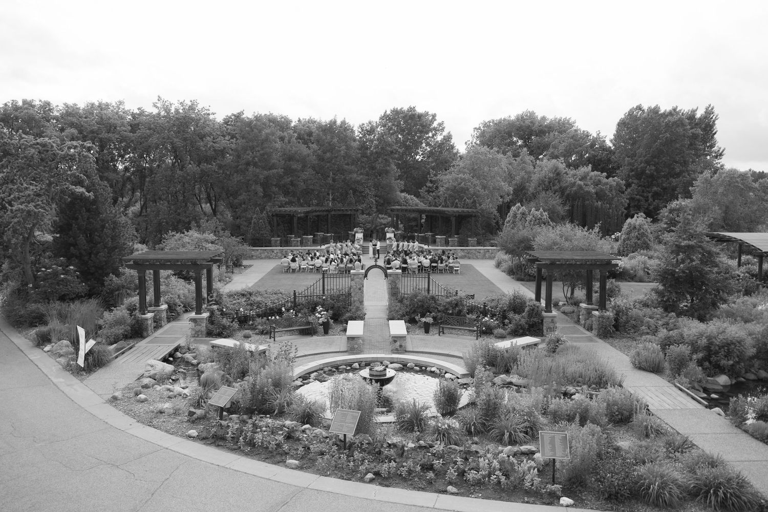 wide scale image of a outdoor garden ceremony at the plymouth community center in plymouth mn