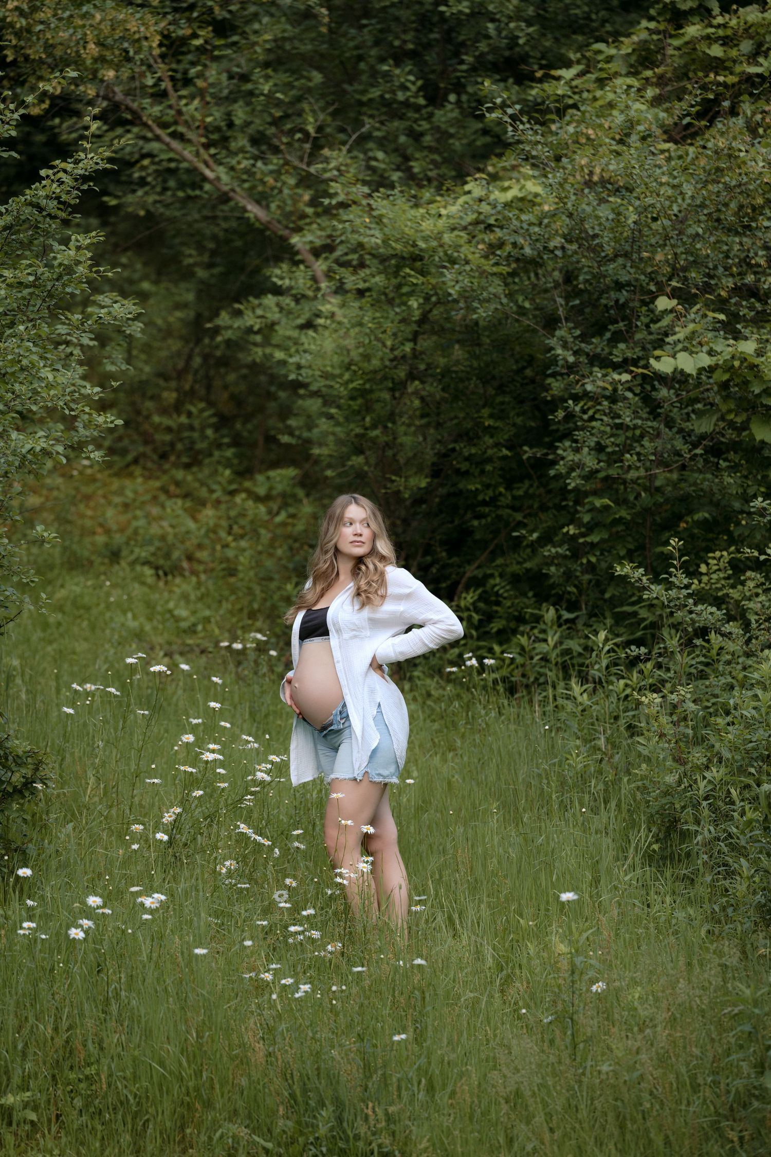 personal portraits of jagger rose photography during outdoor maternity session in a flower field wearing calvin klein