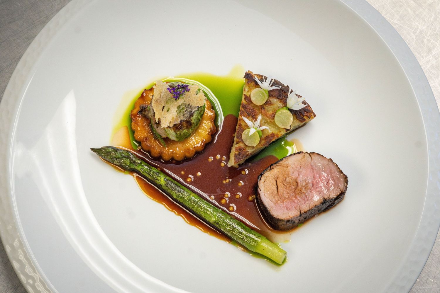 BBQ Pork Fillet, Glazed Faggot, Potato Rosti, Wild Garlic Emulsion, Giant Asparagus, Caramelised Apple, Burnt Apple Puree, Pork Jus split w