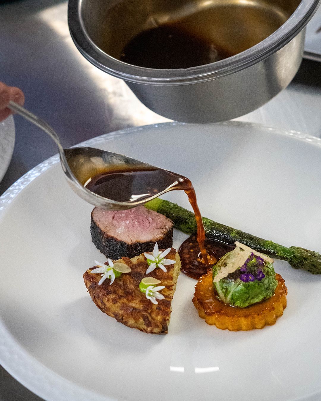 BBQ Pork Fillet, Glazed Faggot, Potato Rosti, Wild Garlic Emulsion, Giant Asparagus, Caramelised Apple, Burnt Apple Puree, Pork Jus split w