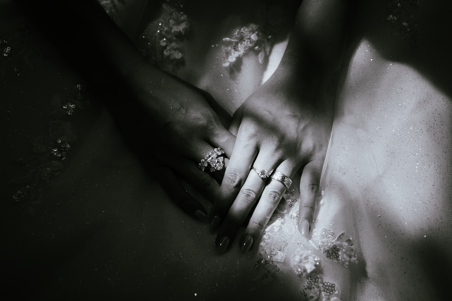 Artistic black and white close-up shots with dramatic lighting and shadows.