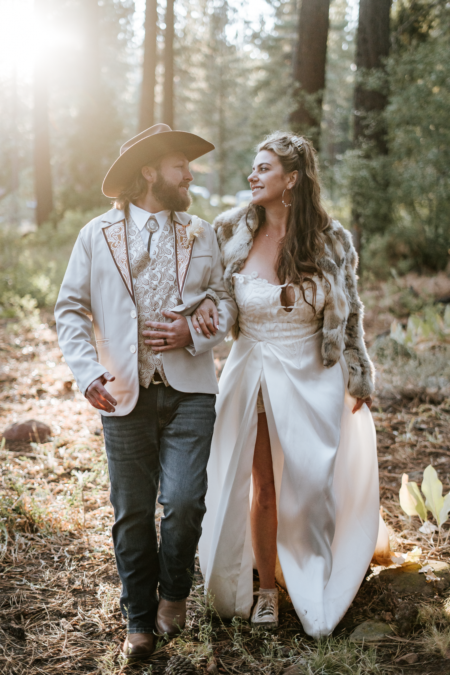A romantic couple shares an intimate moment during sunset photos, in a sunlit forest in Lake Tahoe, California..
