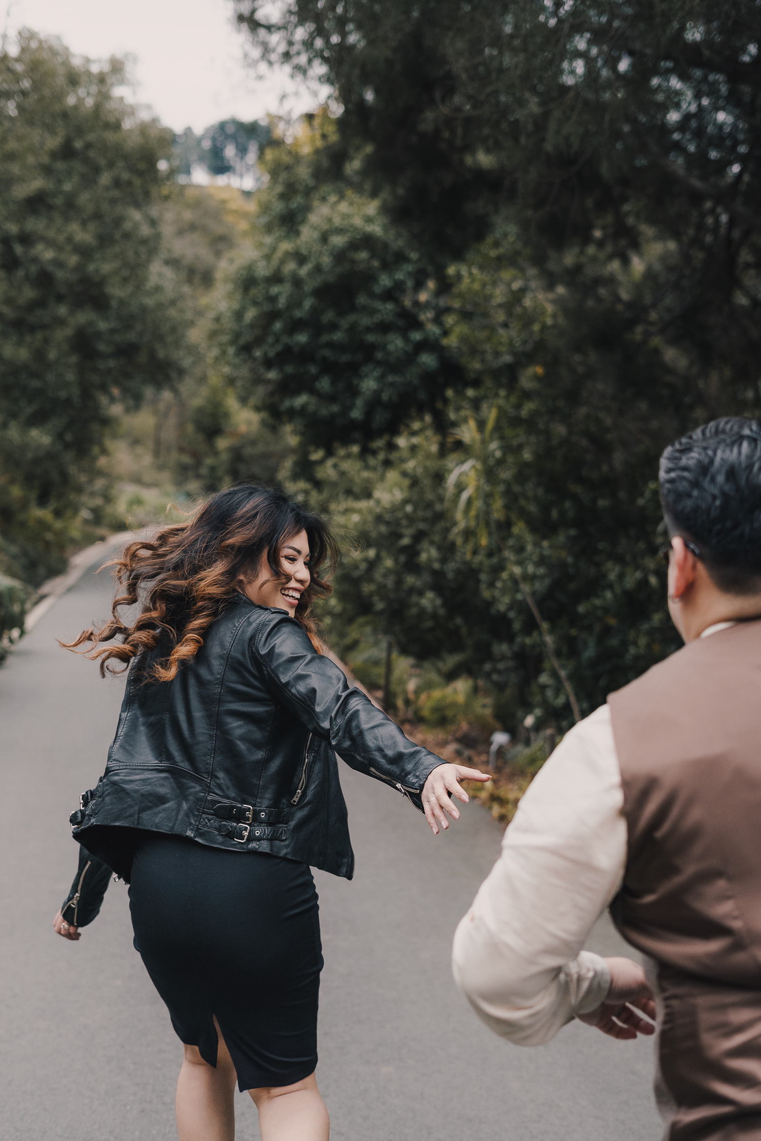 A sequence of action shots showing two people in motion on a path surrounded by trees in autumn.