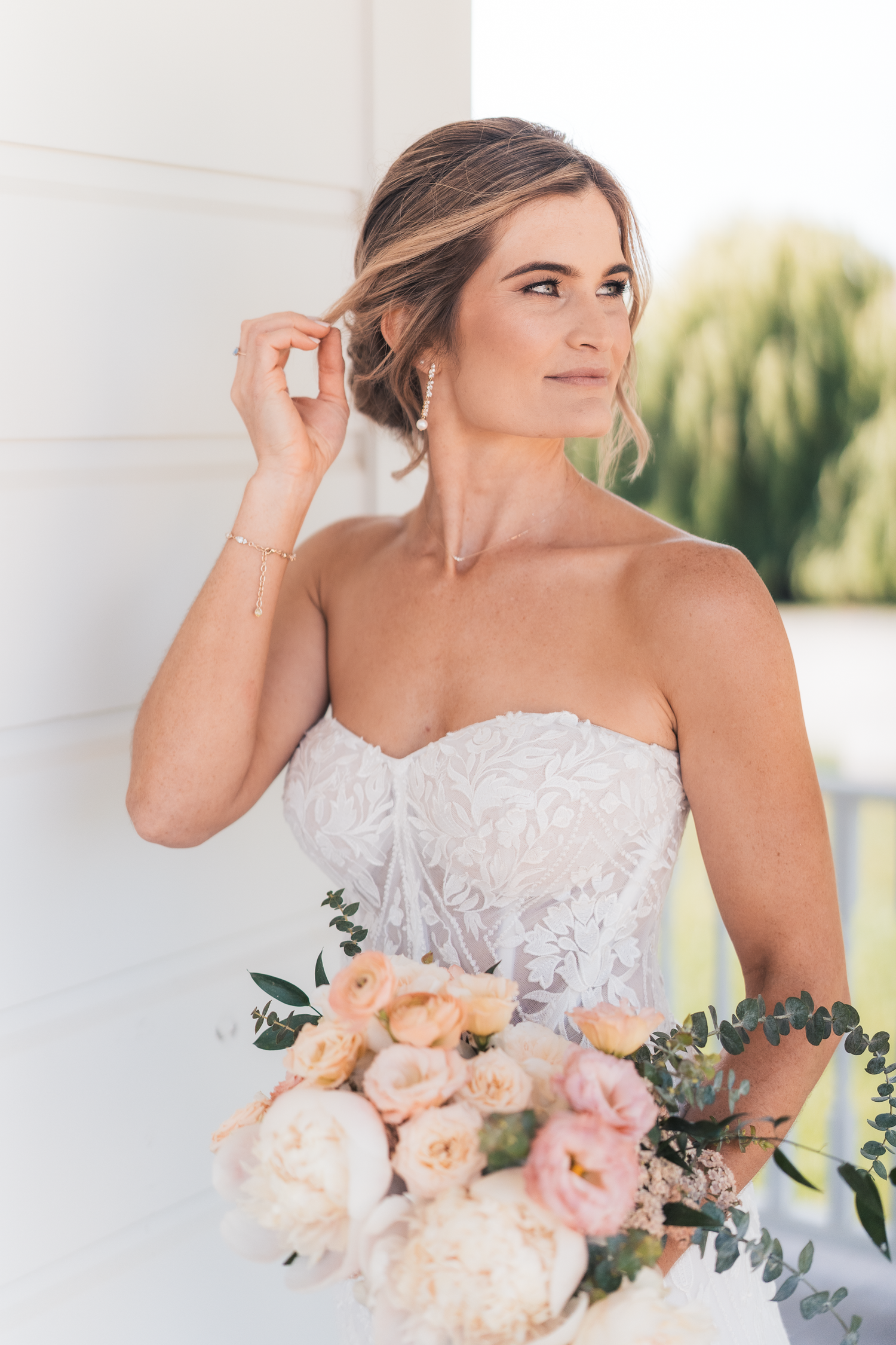 Elegant bridal portrait featuring a lace dress and peach floral bouquet at Olympia's Valley Estate in Petaluma.