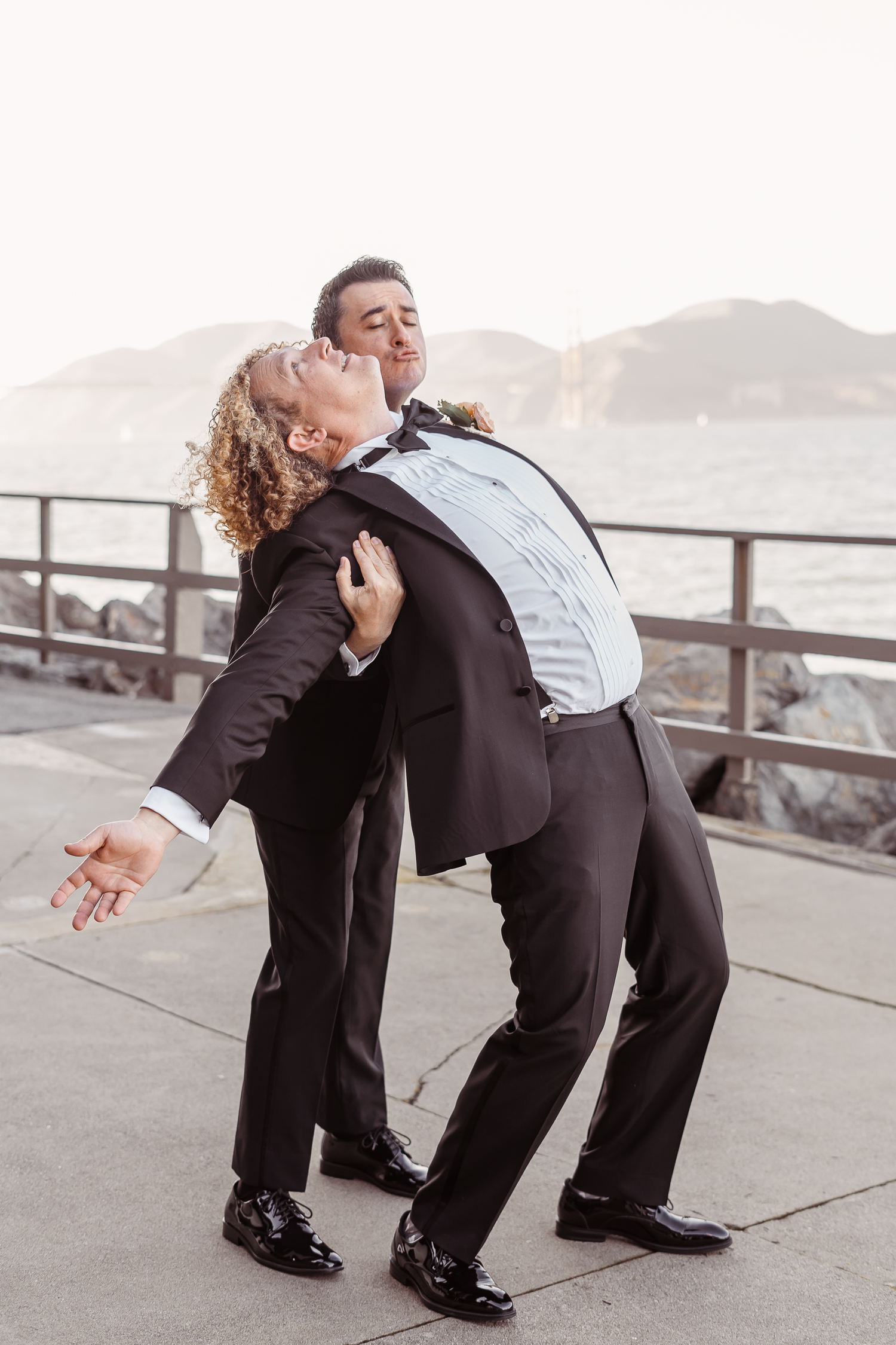 Groom and a groomsmen goofing off at a San Francisco wedding.