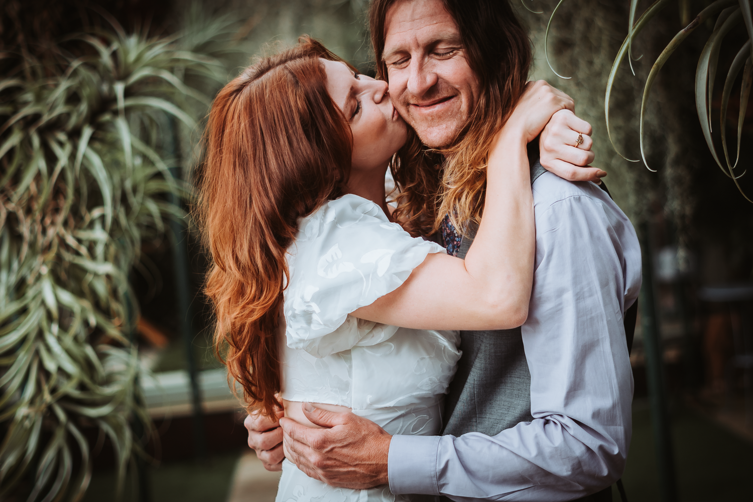 Intimate engagement photo captured in a natural light at Shelldance Orchid Farm in Pacifica..