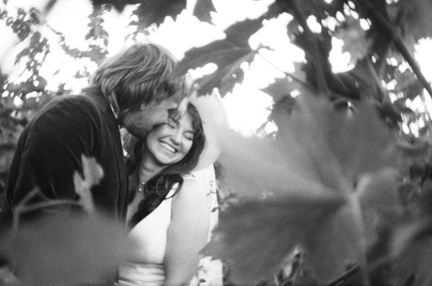 Romantic outdoor wedding photography with natural lighting and foliage. Photographed on film in the North Bay