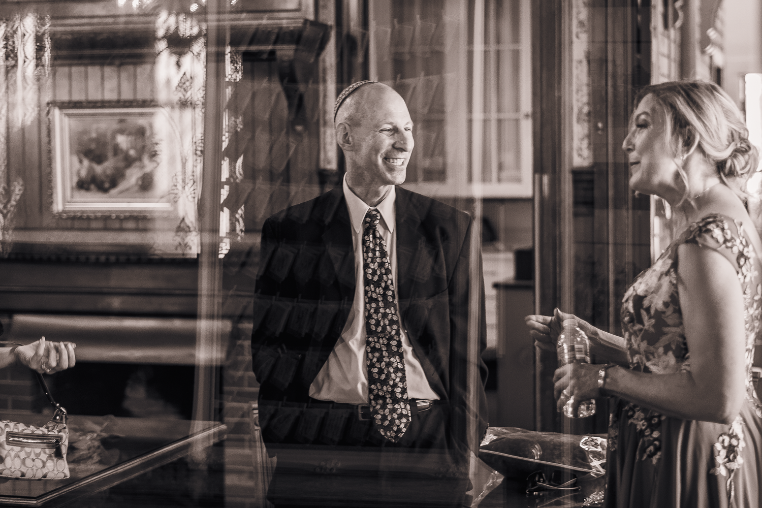Candid black and white photo of officiant at Falkirk Mansion in Marin County.