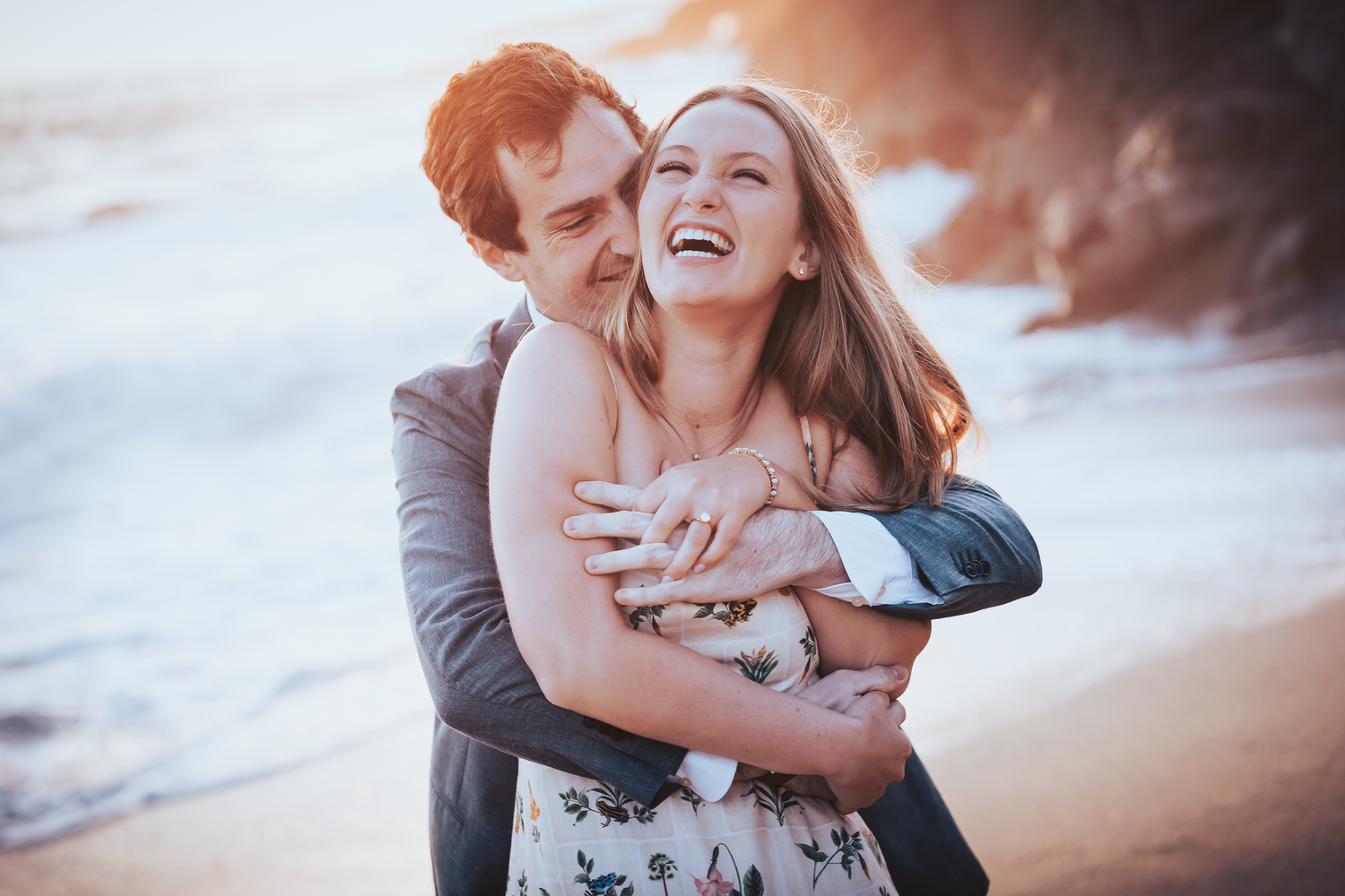 Romantic sunset beach portraits capturing tender moments between a couple at Bodega Bay in Sonoma County.