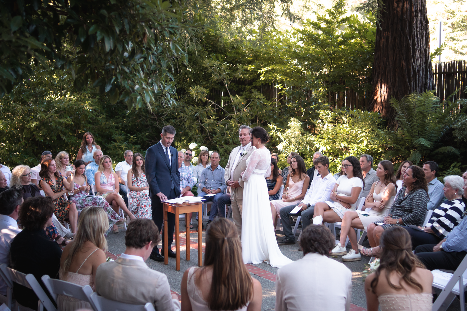 A series of outdoor wedding ceremony photos showing guests seated in a garden setting during a summer celebration.