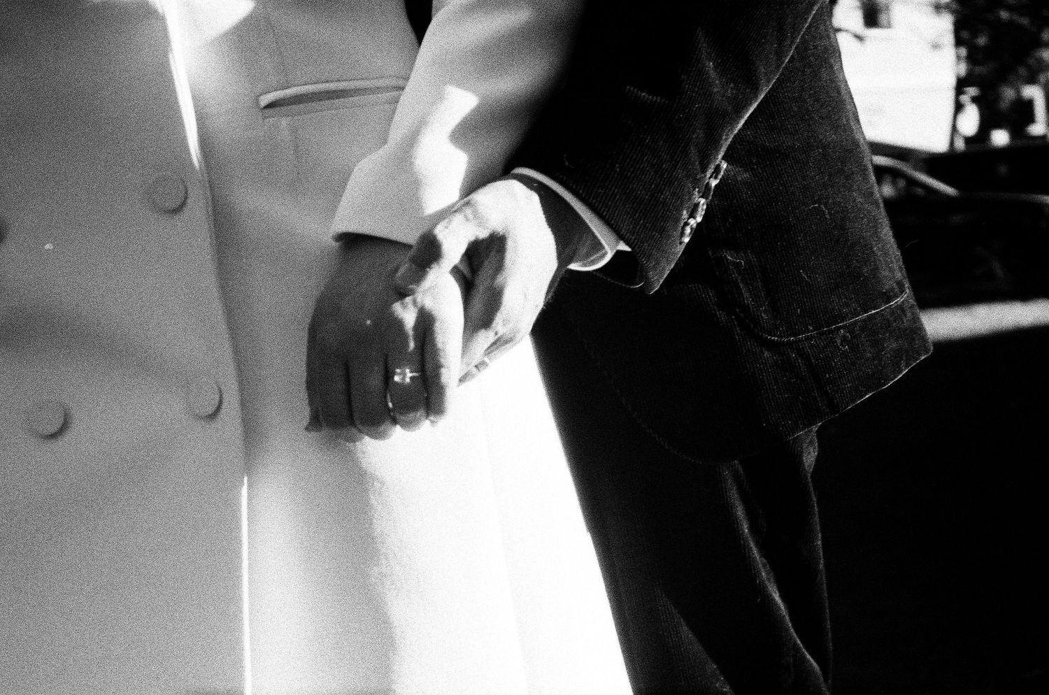 Close-up black and white shots showing tender moments between newlyweds.