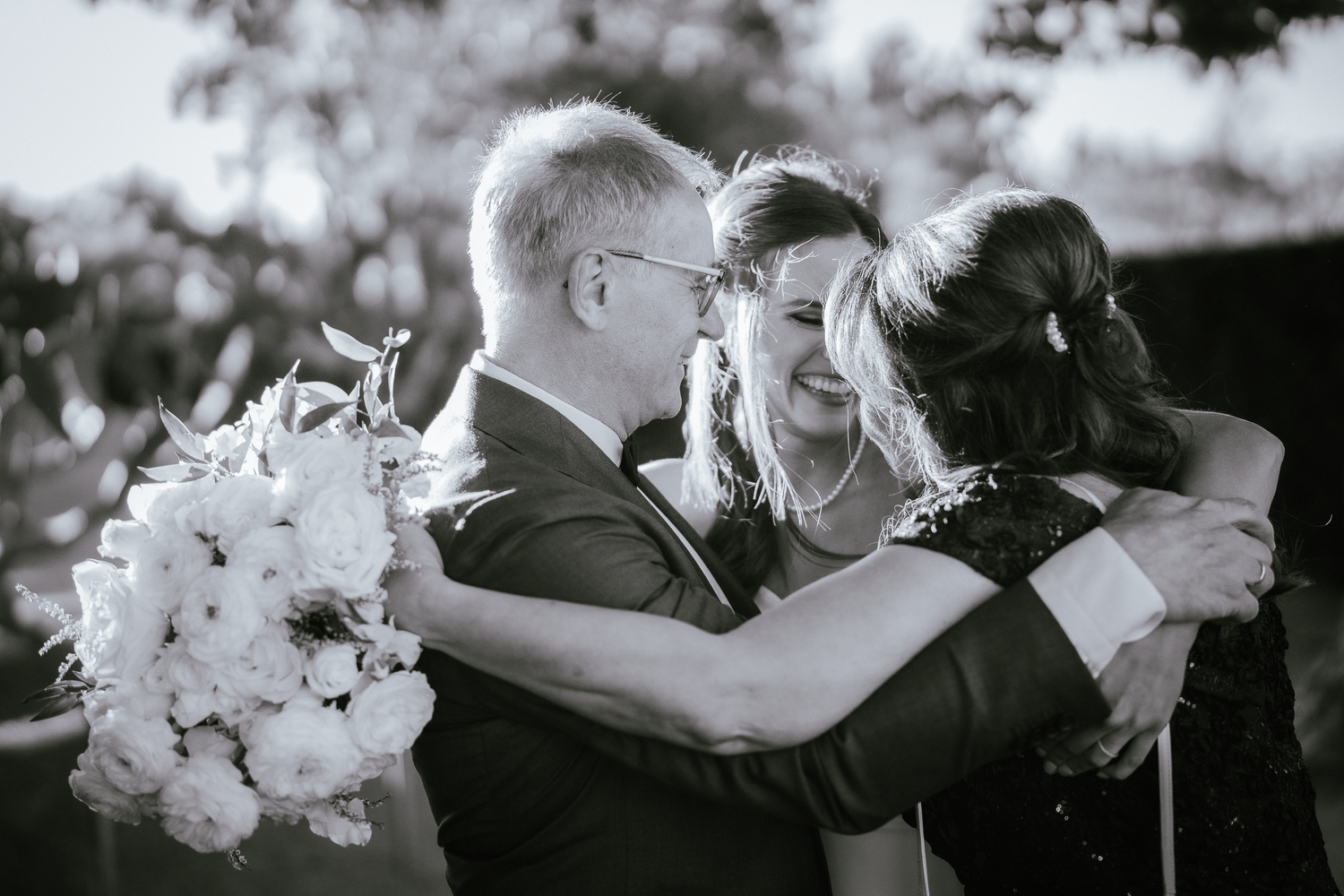 Black and white close-up shots of wedding celebration moments and embraces at Cornerstone Sonoma.