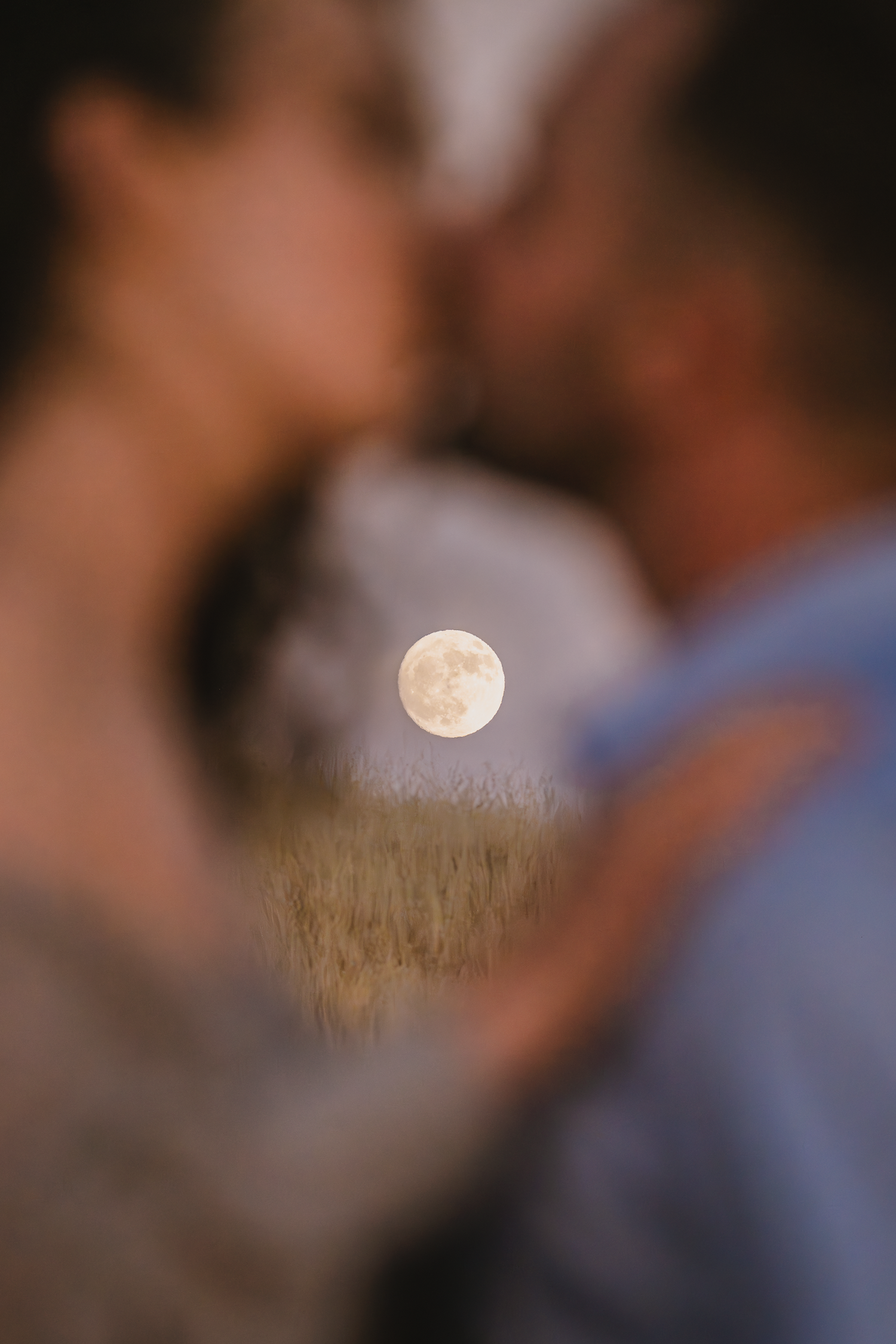 Romantic couple embraces under a full moon in a dreamy outdoor setting on Mount Tamalpais in Marin County.
