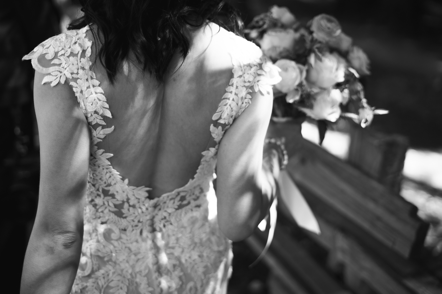 A black and white photo collage shows multiple candid moments from a wedding celebration with lace dress details.