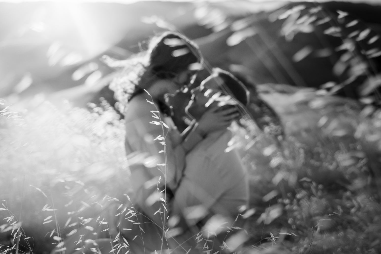 Ethereal black and white photo of grass blowing in the air during an engagement photoshoot on Mount Tamalpais in Marin County.