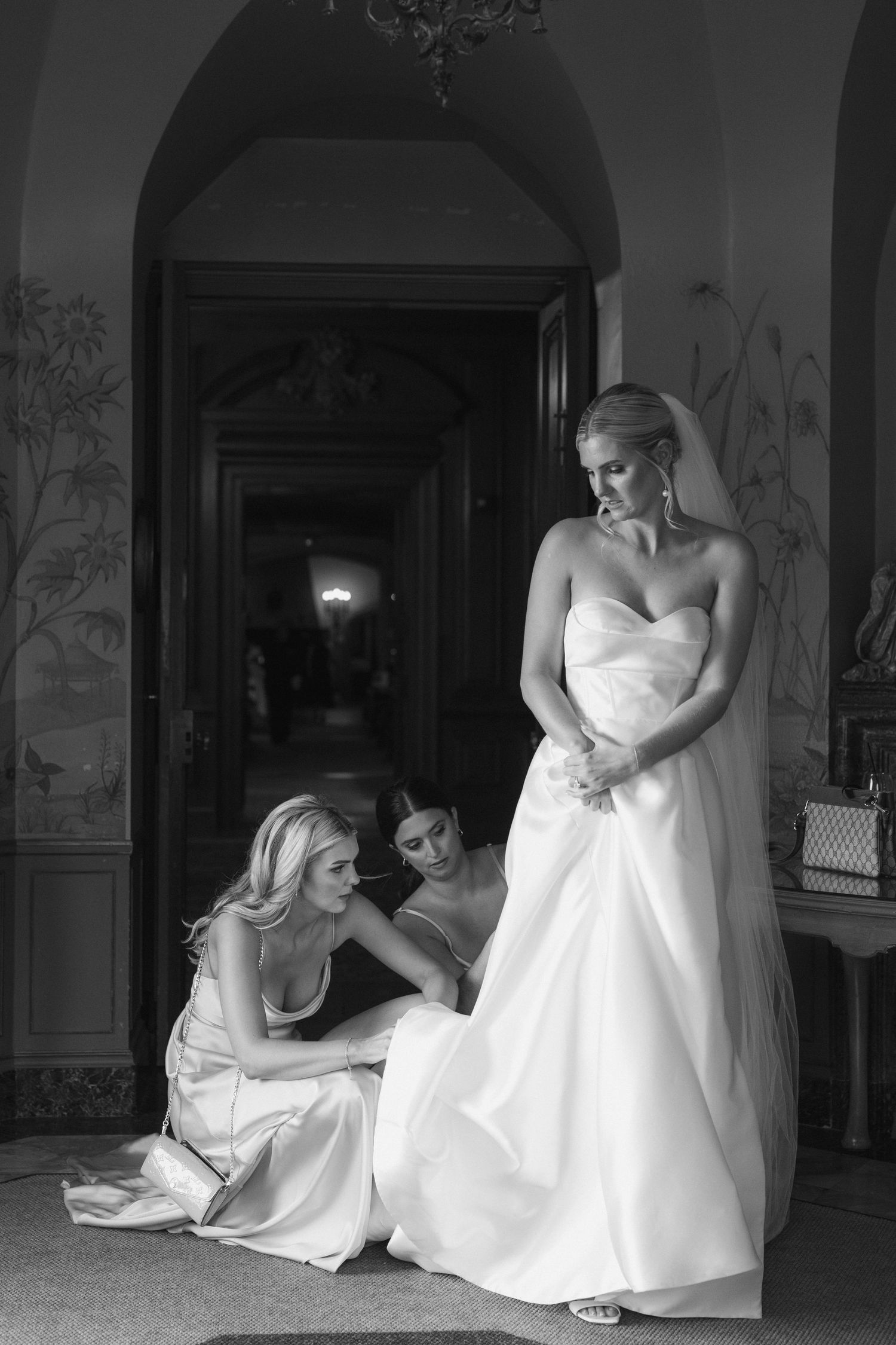 A series of black and white bridal portraits showing a woman in a white wedding dress sitting in various elegant poses.