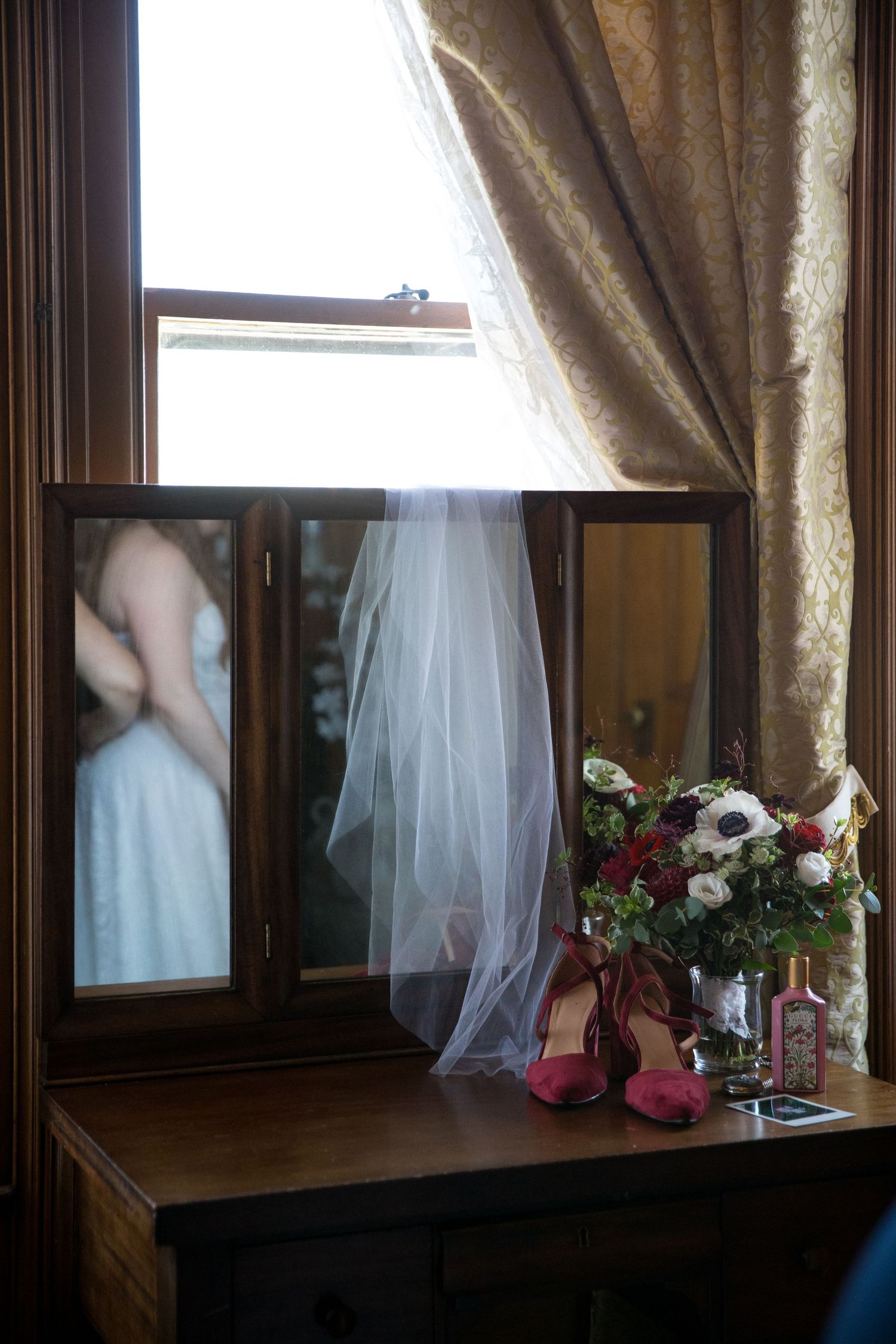 Artistic wedding photo sequence showing bridal veil movement against window with curtains and floral arrangement.