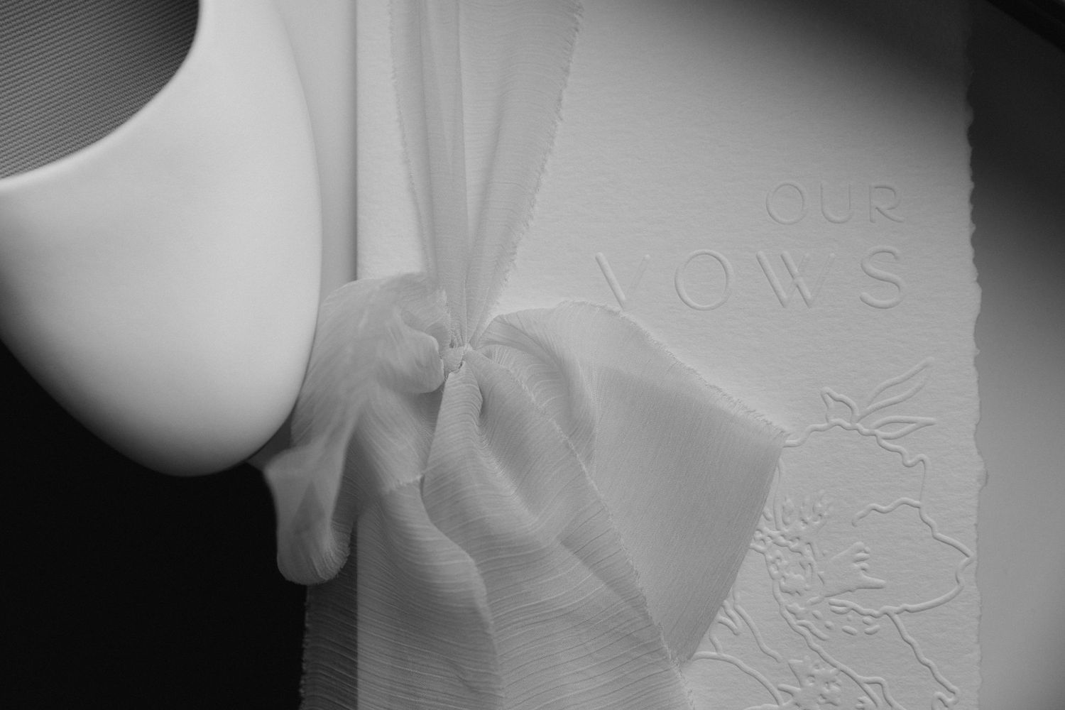 Close-up view of embossed paper towel texture showing intricate raised patterns and designs.