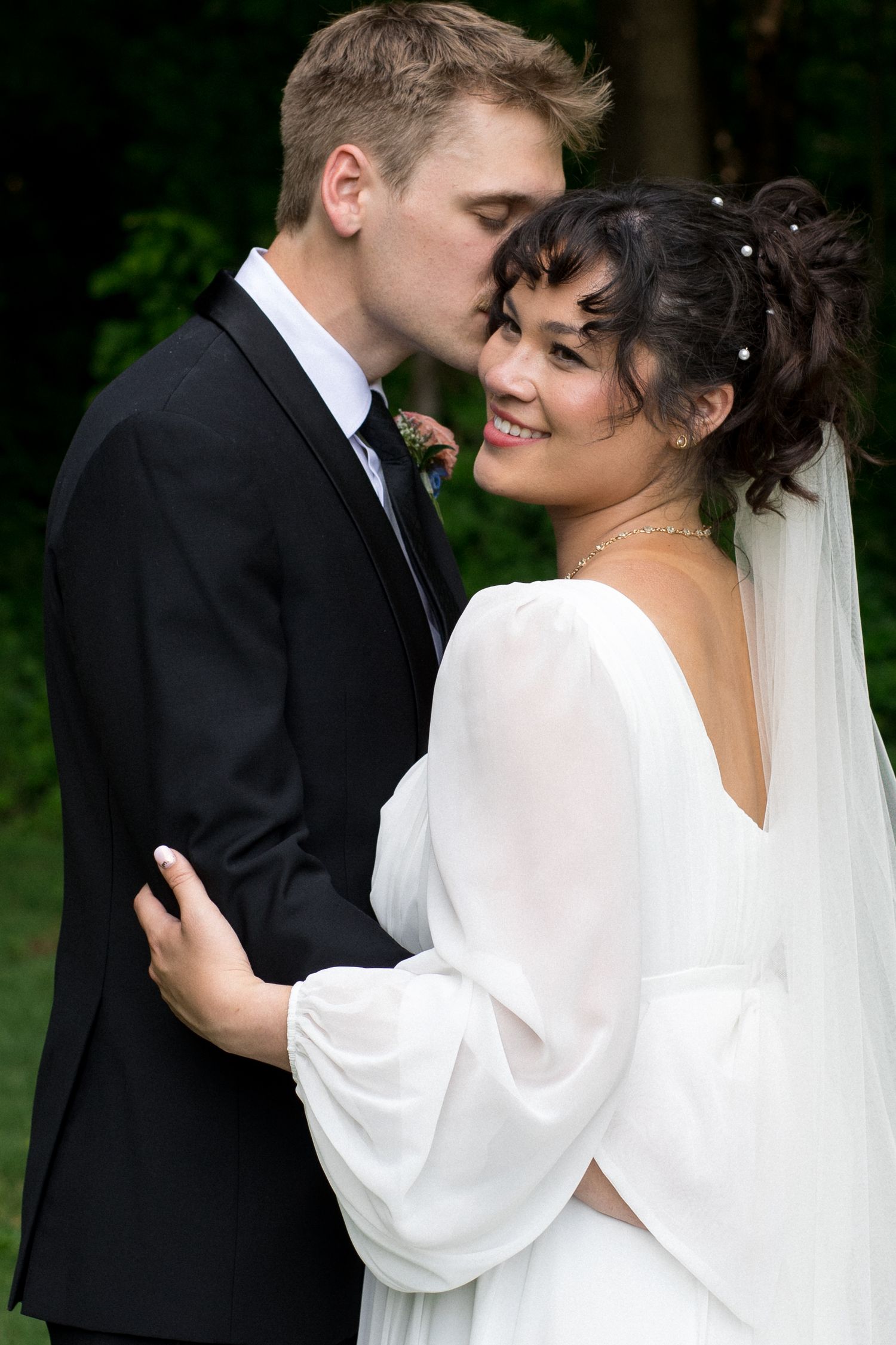 A romantic wedding photoshoot sequence showing tender moments between a couple in traditional black and white attire.
