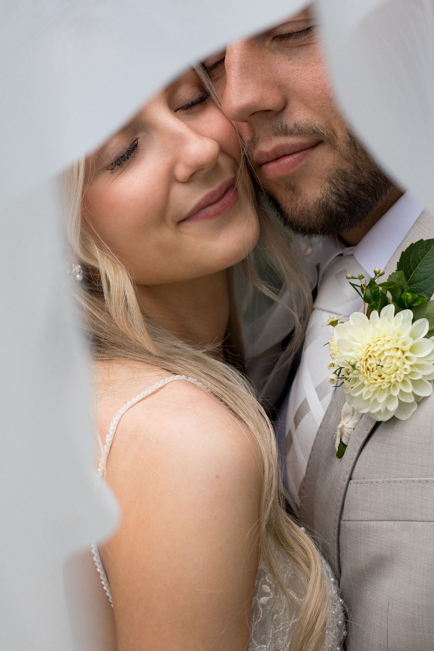 A romantic wedding portrait series showing tender moments between a couple in formal attire.