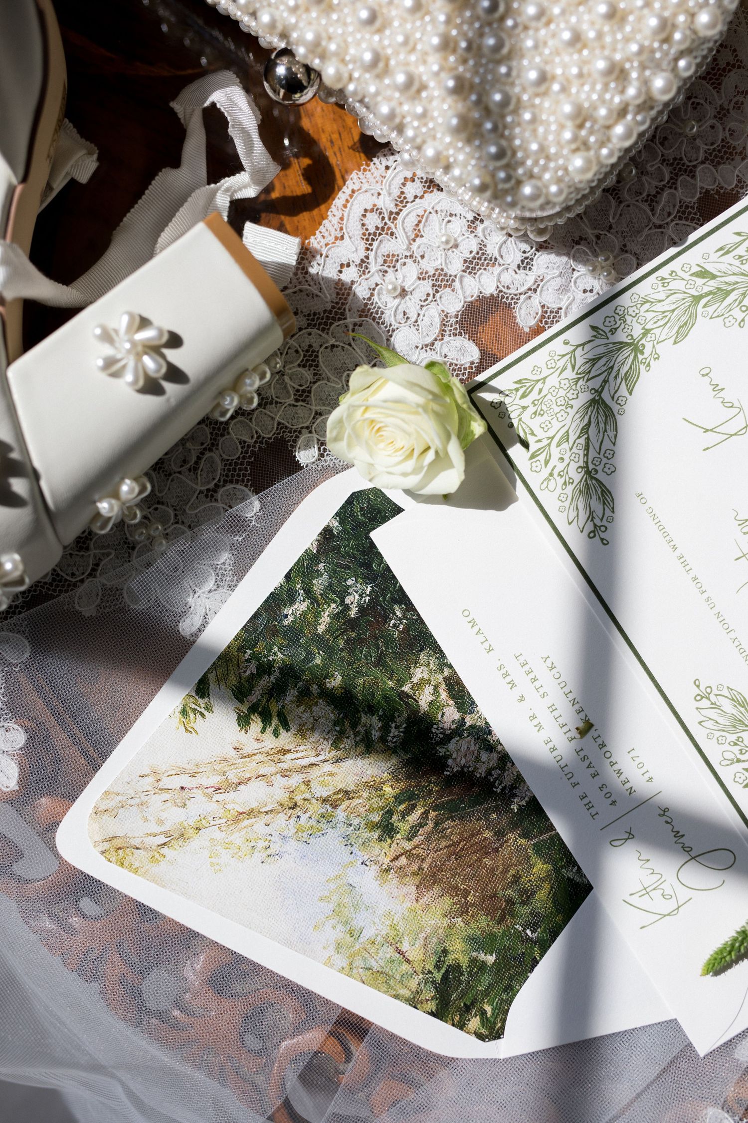 Close-up view of watercolor illustration pages with delicate floral designs and text scattered across white paper.