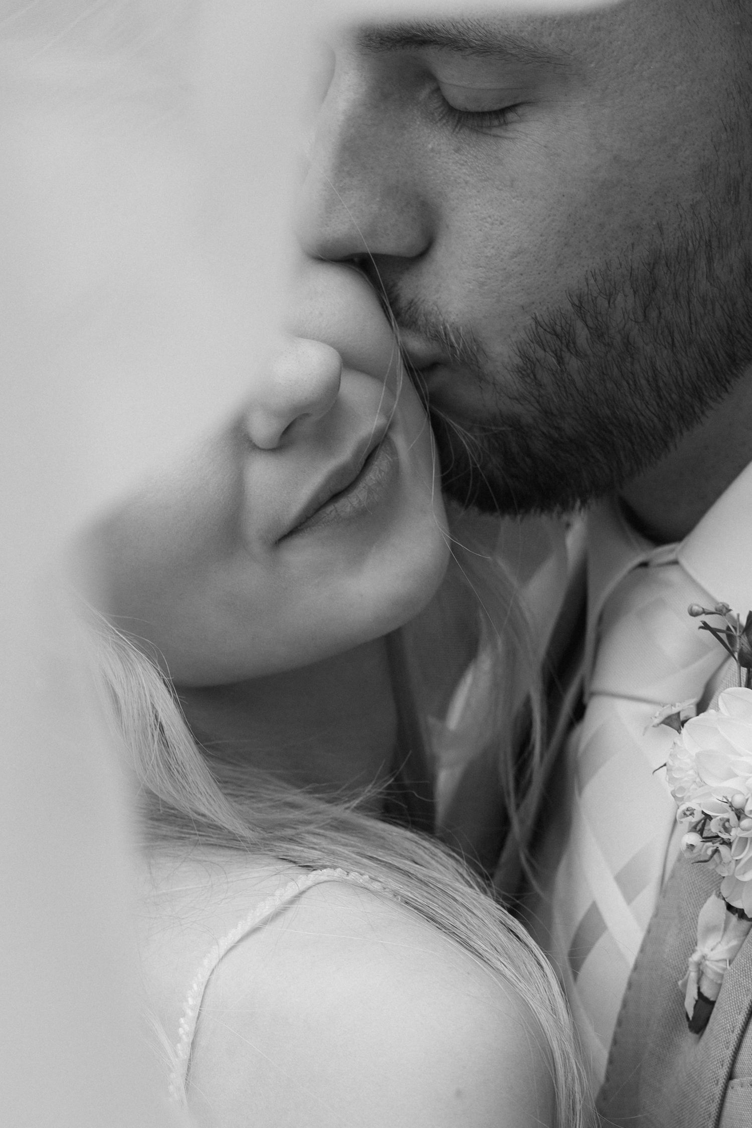 A romantic black and white photo series showing tender intimate moments between a couple in close-up profile views.