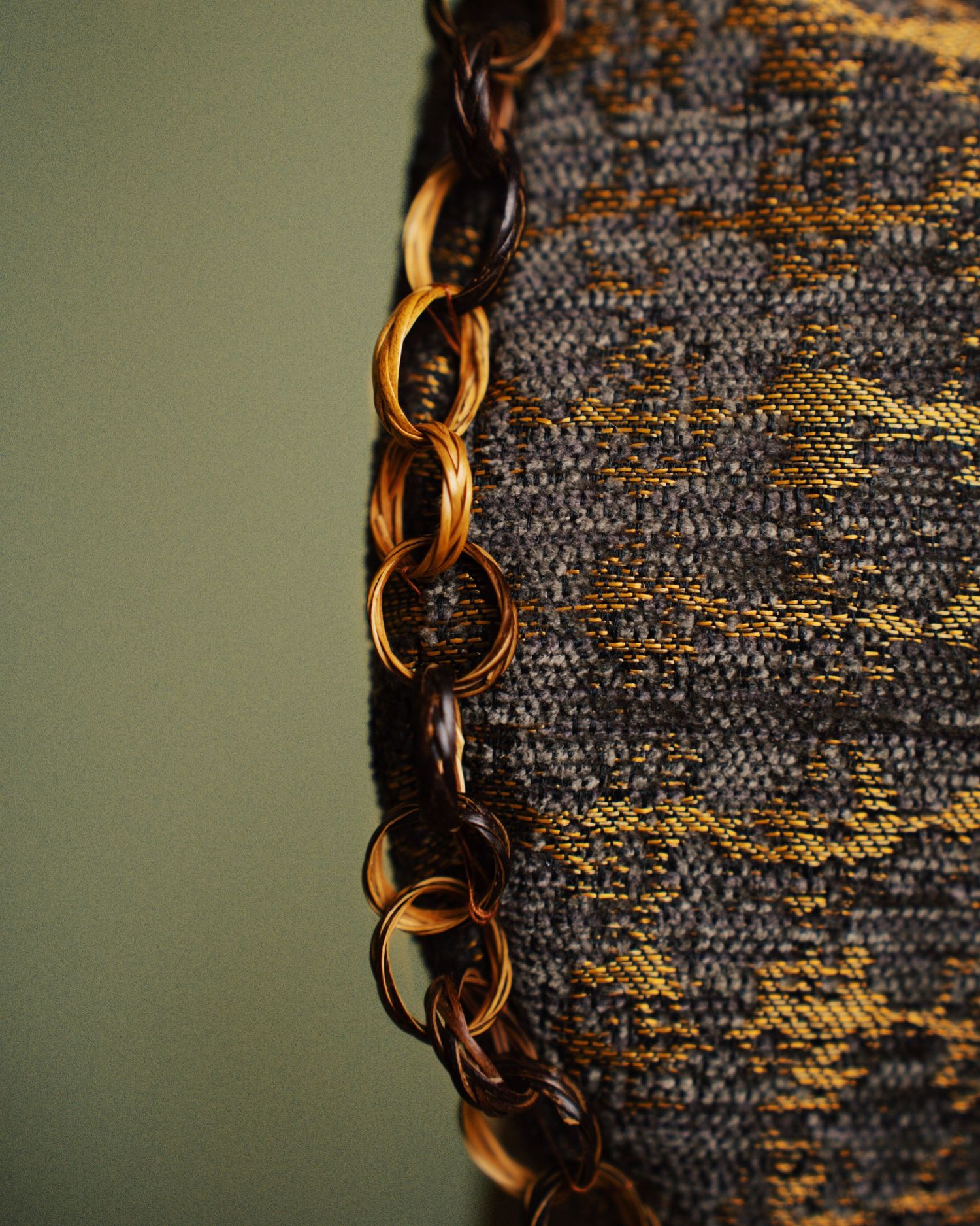 Studio still life photographs of DALì handbags, shot against a colored background.