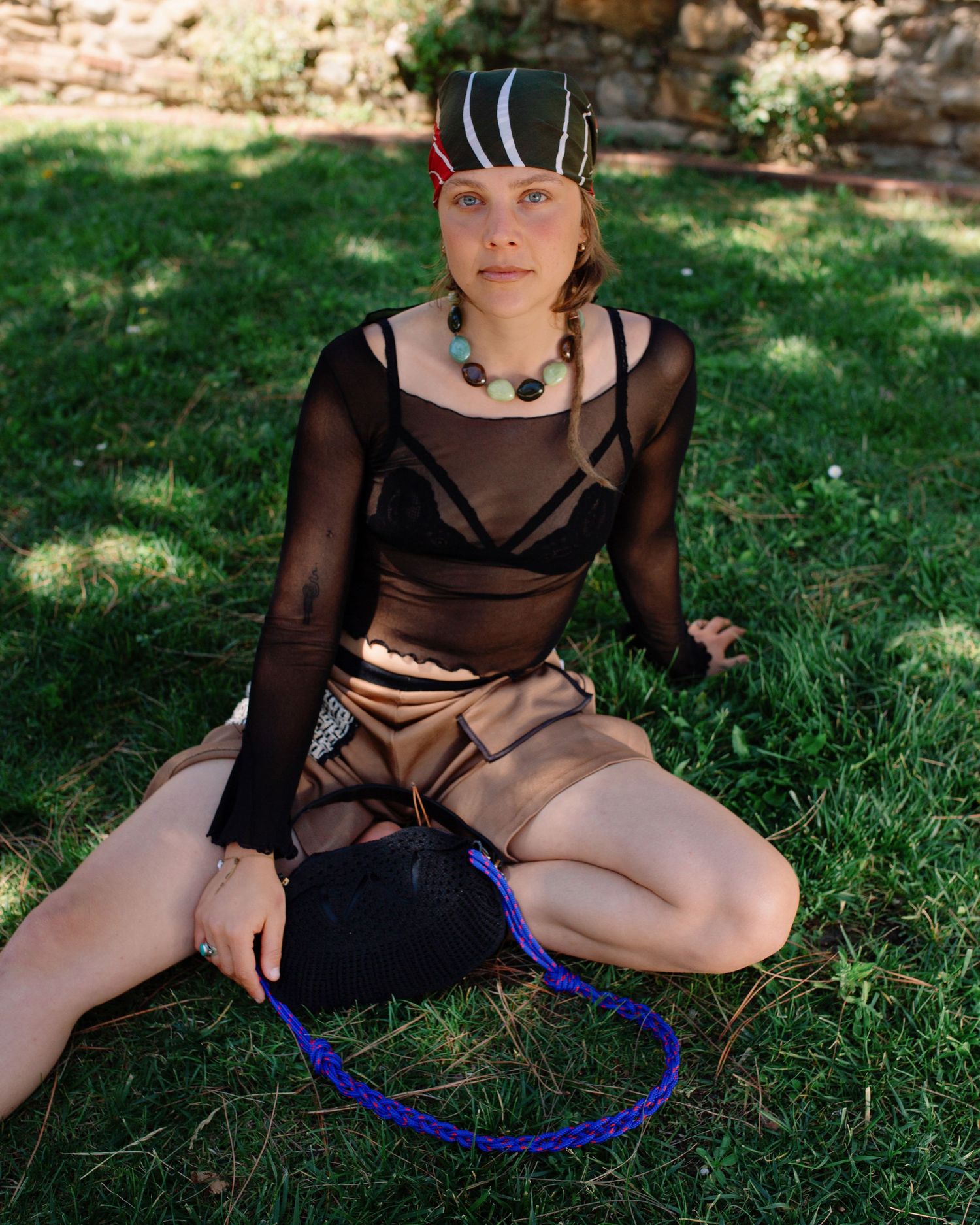 Photograph of a girl on grass. Photography by studio sale.
