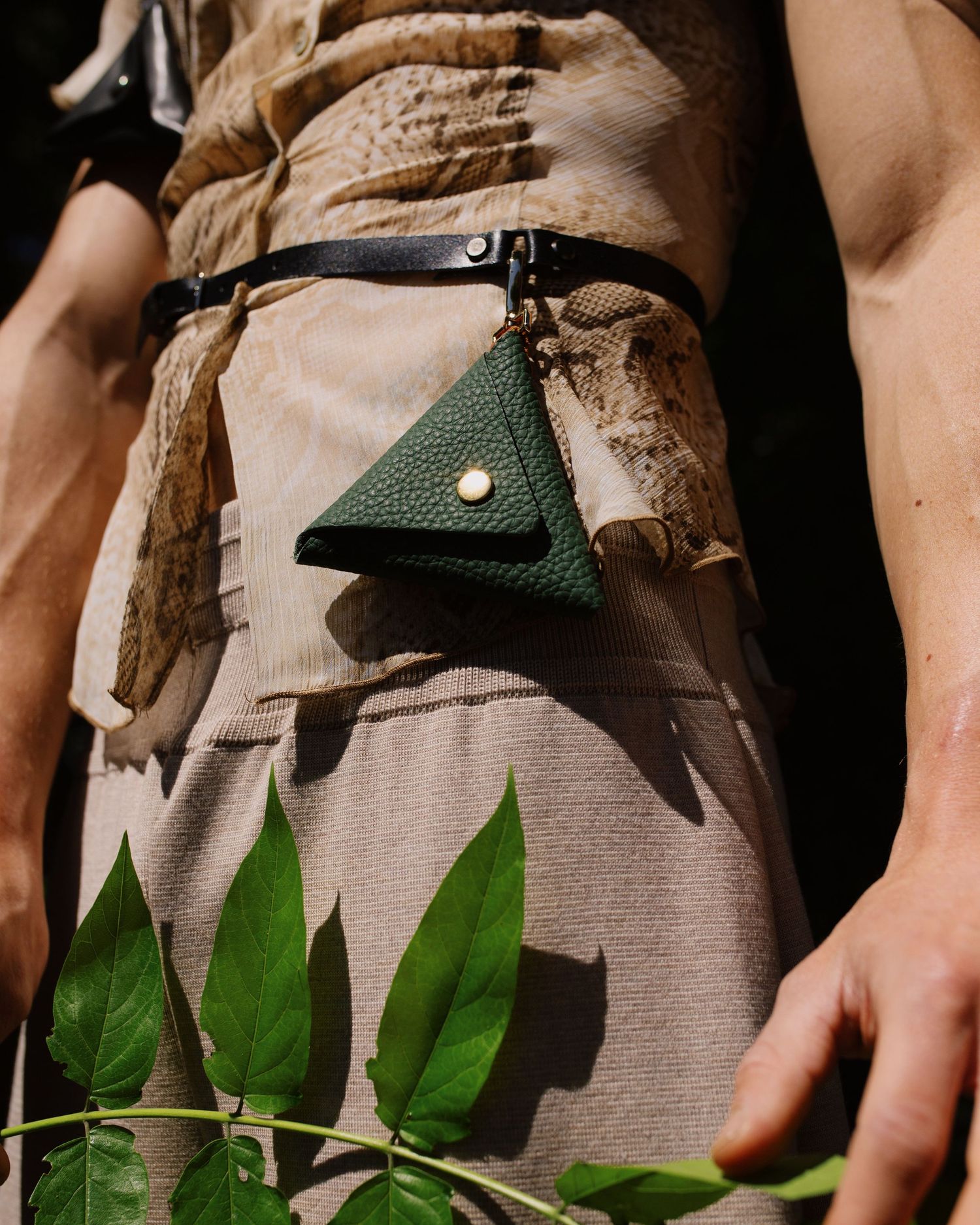 Photograph of a belt detail. Photography by studio sale.