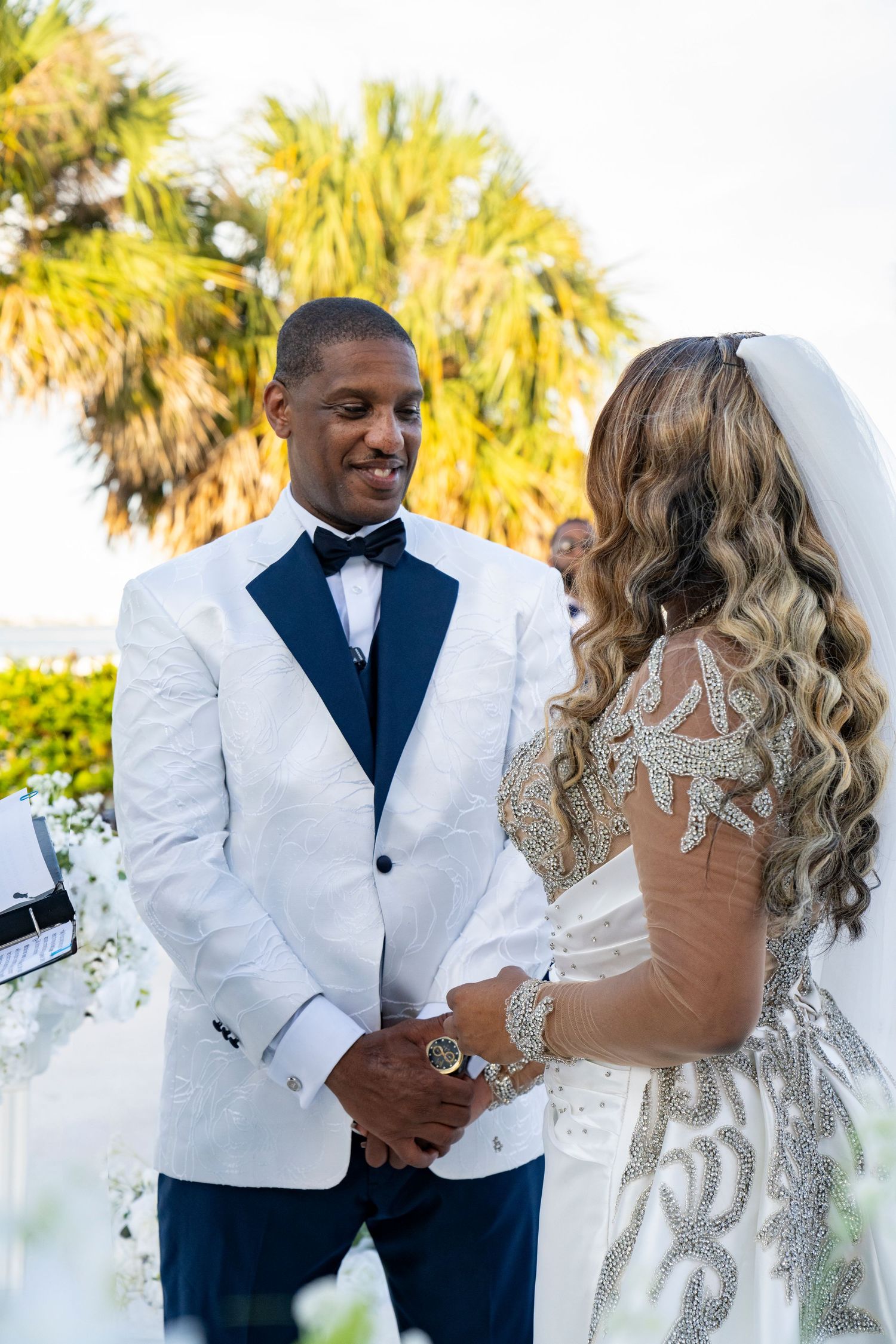 Perspective of bride looking at groom as they hold hands at tuckahoe mansion estate.