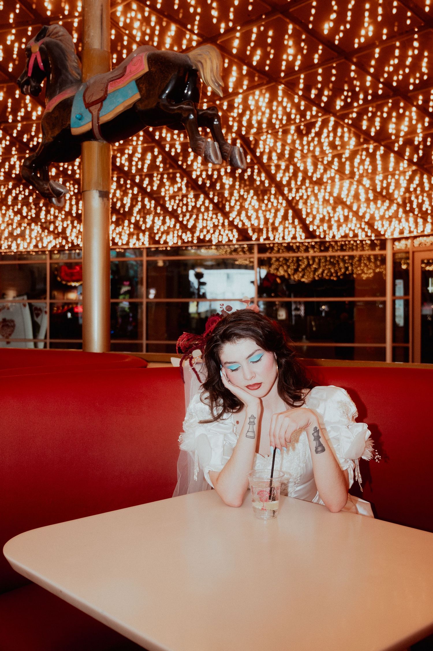 Editorial vintage bridal portraits under the neon lights of fremont street at a bar