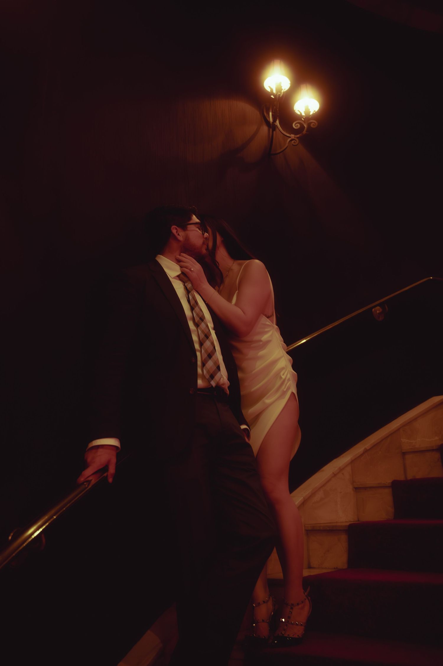 Engaged couple kissing on the stairs in a Las Vegas Casino. Casino wedding picture Las Vegas