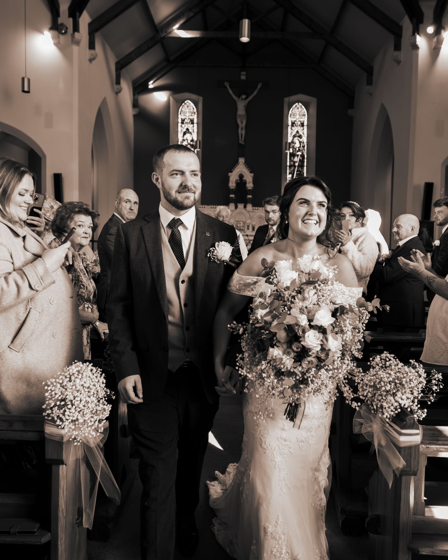 Black and white photo series captures emotional wedding ceremony moments in church setting.