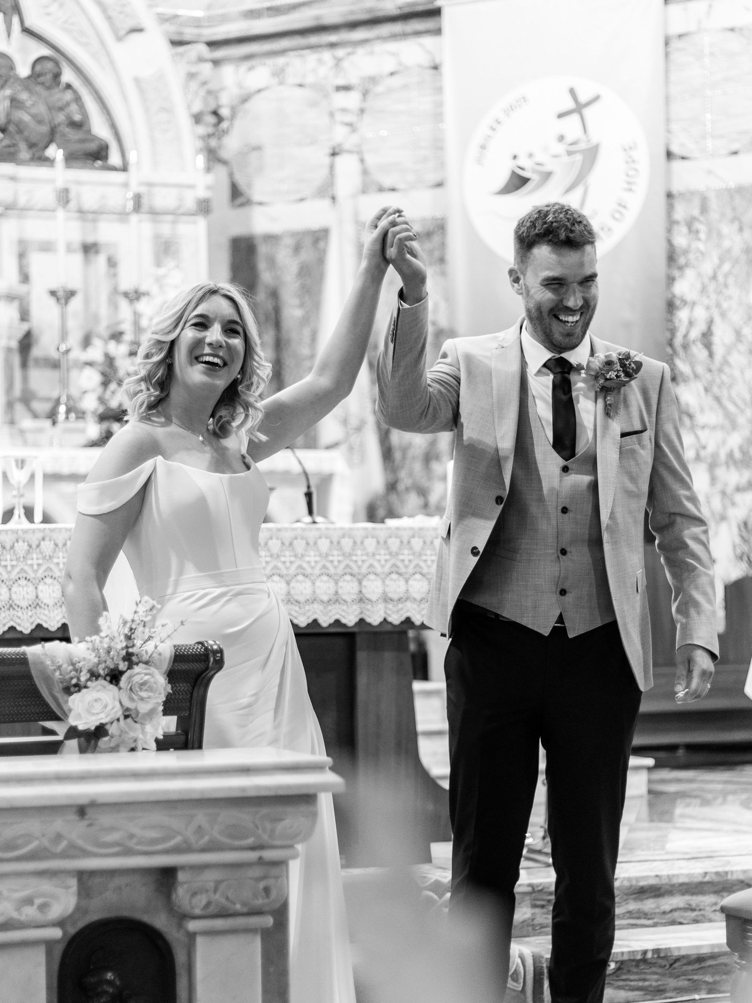 A series of candid black and white wedding photos showing joyful moments and laughter between couples.