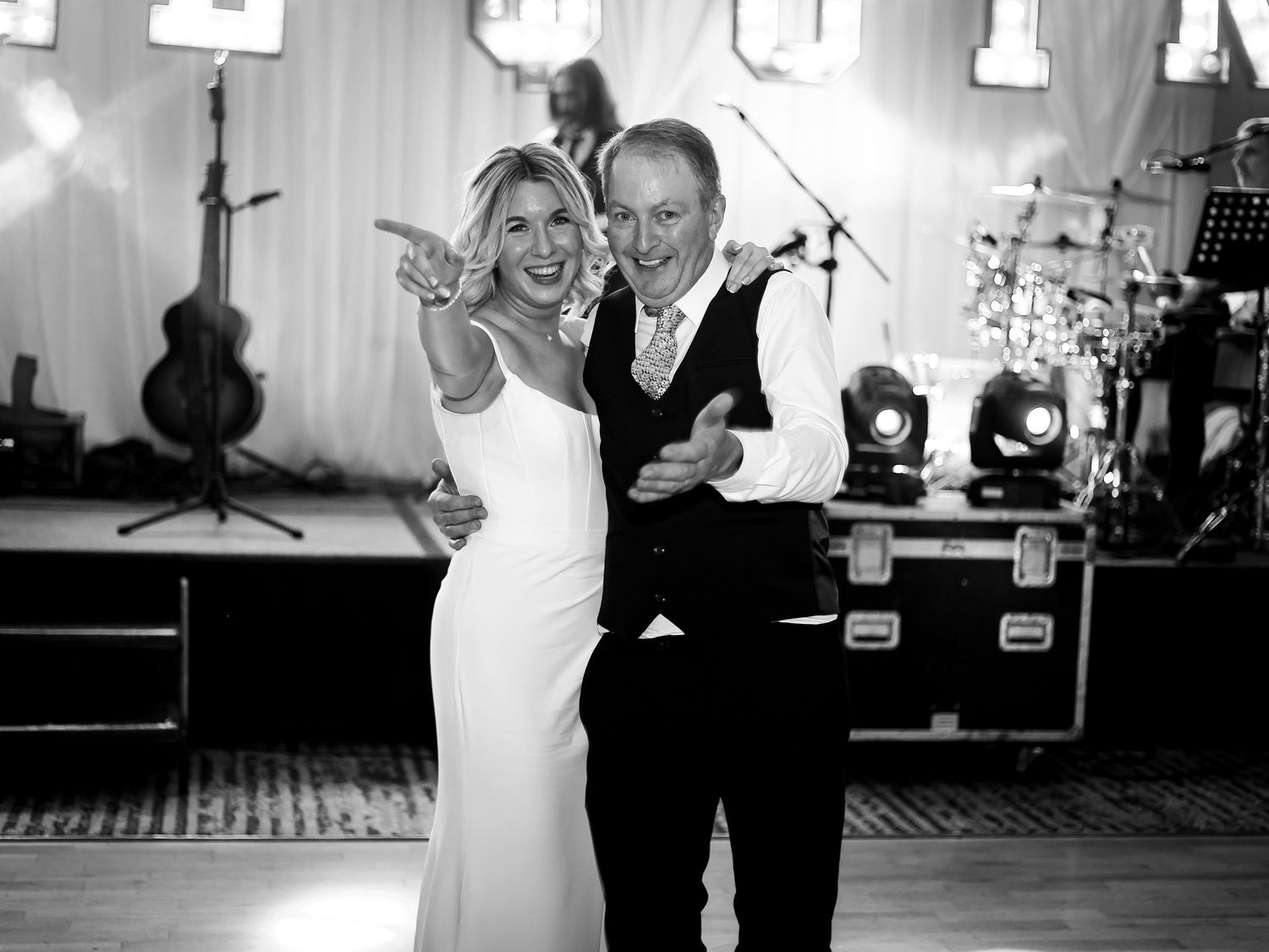 A series of black and white wedding reception photos showing couples dancing together at a celebration.